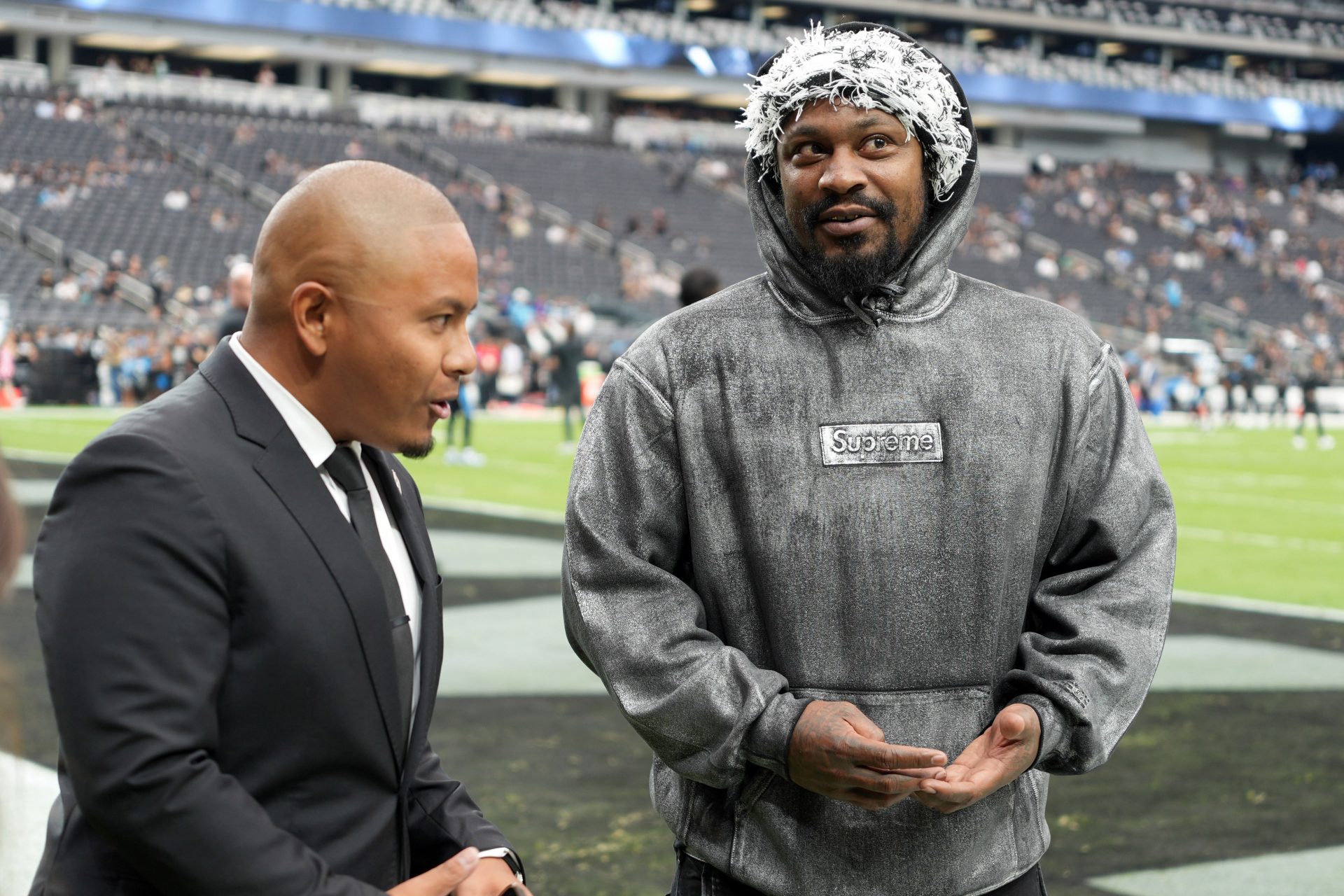 Marshawn Lynch (right) talks with Marcus Padilla during the game between the Carolina Panthers and the Las Vegas Raiders  - Source: Imagn