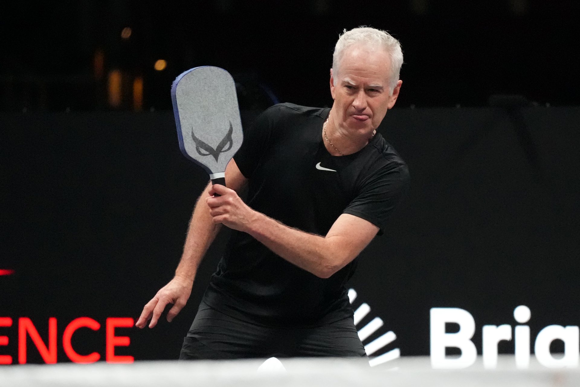 John McEnroe returns a volley during Pickleball Slam 2 at Hard Rock Live at Seminole Hard Rock Hotel & Casino.