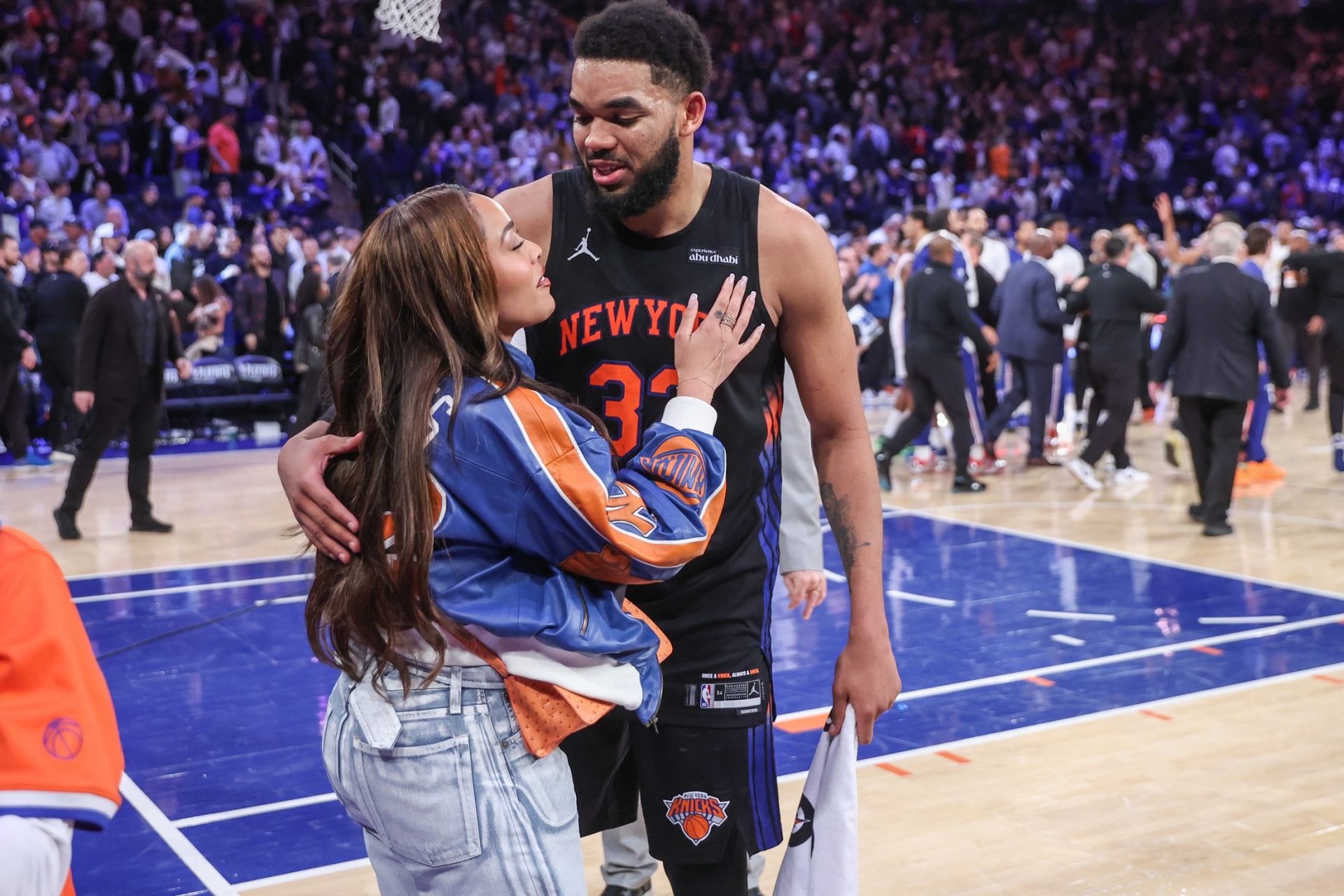 New York Knicks center Karl-Anthony Towns (32) greets his fiancee, Jordyn Woods, after defeating the Philadelphia 76ers 108-102 in  game five of the second round of the 2026 NBA Playoffs at Madison Square Garden - Source: Imagn Images