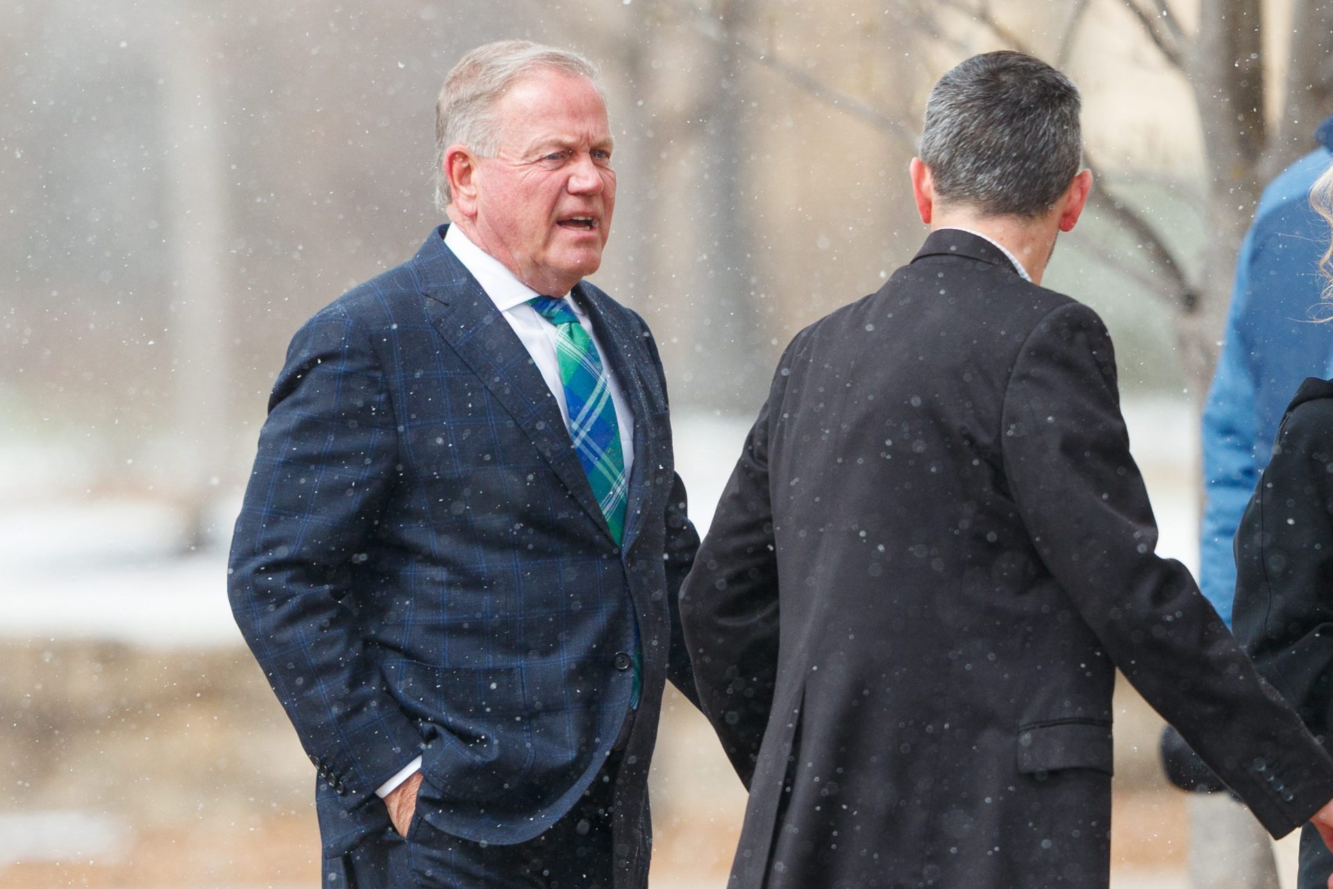 Brian Kelly, left, arrives at the funeral service for former Notre Dame football head coach Lou Holtz at the Basilica of the Sacred Heart at the University of Notre Dame on Monday, March 16, 2026, in South Bend. Holtz died on March 4, 2026. Credit: Imagn