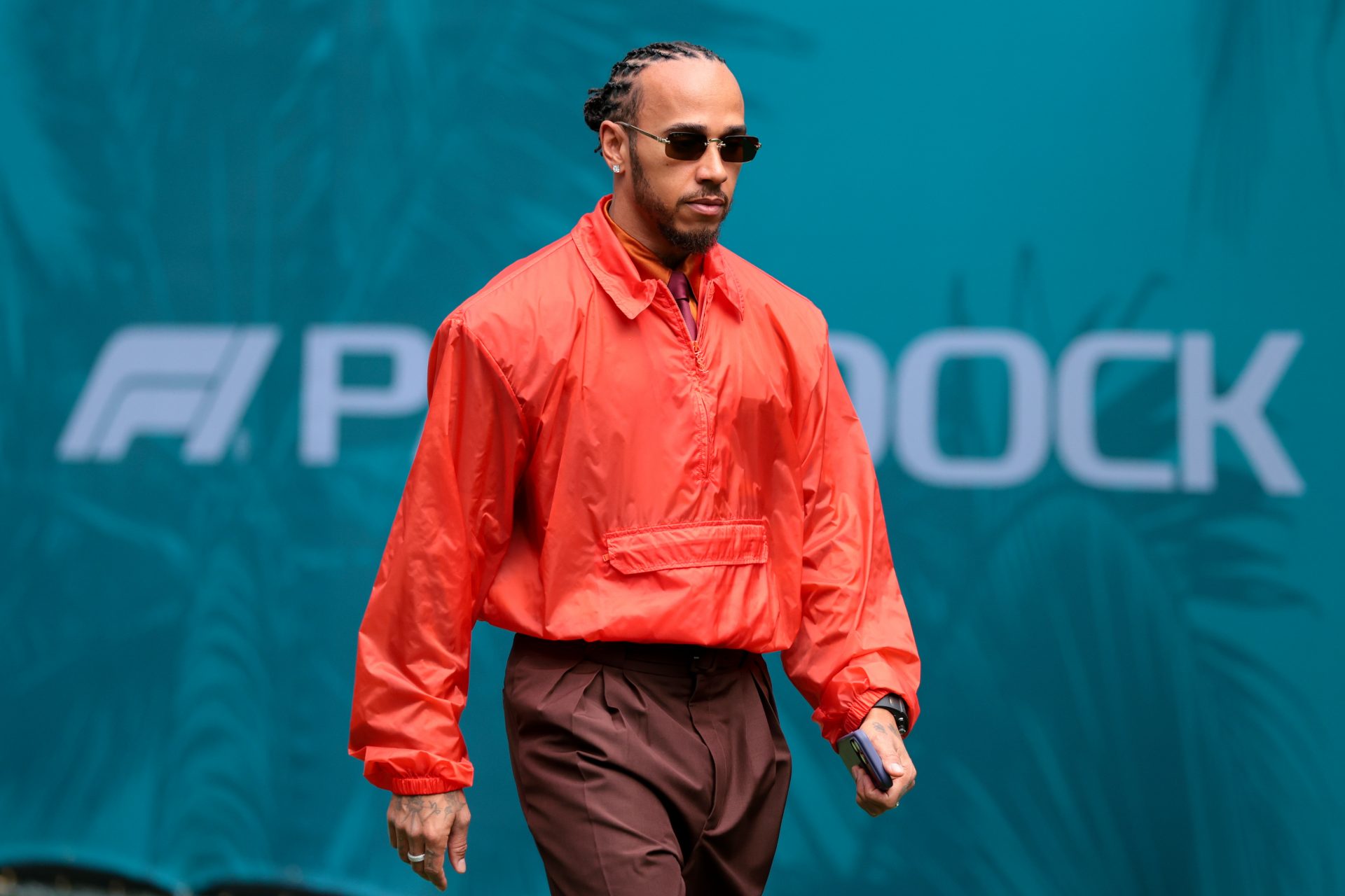 Ferrari driver Lewis Hamilton (44) arrives to the paddock area at Miami International Autodrome.