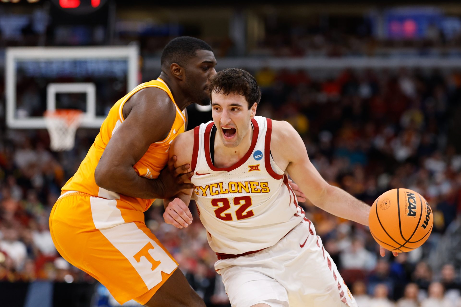 Iowa State Cyclones forward Milan Momcilovic (22) drives the ball against Tennessee Volunteers forward Jaylen Carey (23) in the first half during a Sweet Sixteen game of the Midwest Regional of the men's 2026 NCAA Tournament at United Center.