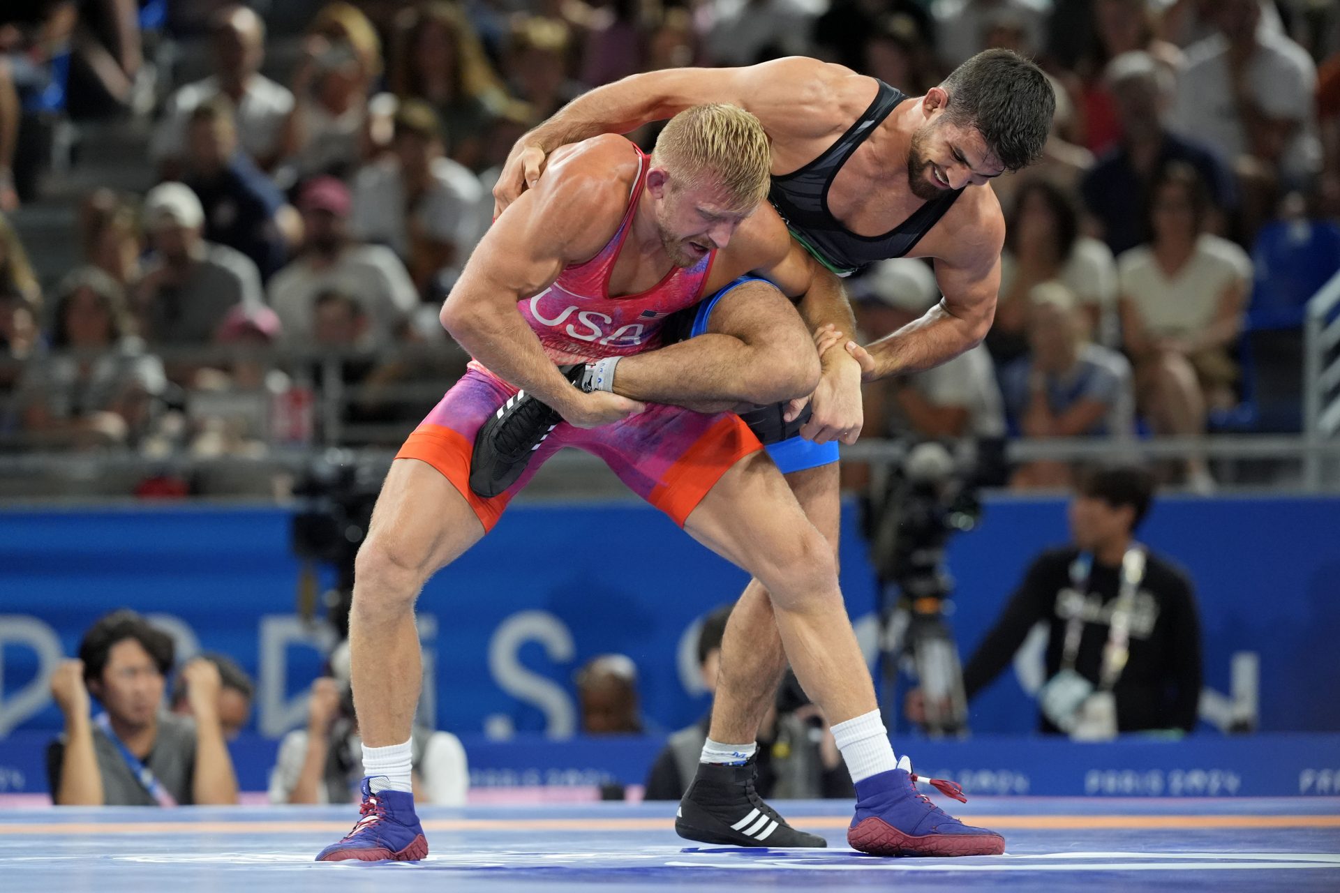 Kyle Douglas Dake (USA) defeats Yones Emamichoghaei (IRI) in a mens freestyle 74kg quarterfinal during the Paris 2024 Olympic Summer Games at Champ-de-Mars Arena.