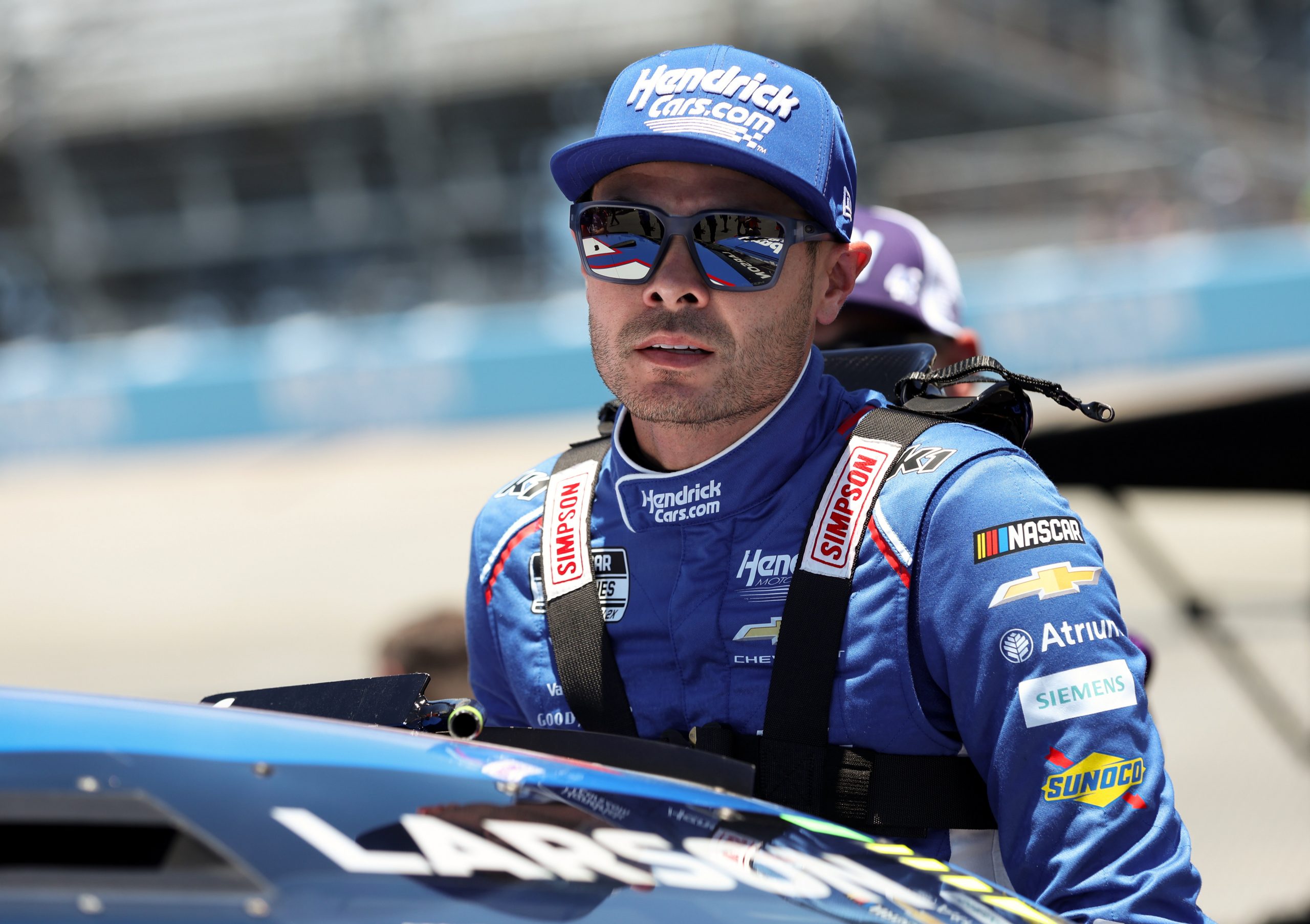 NASCAR Cup Series driver Kyle Larson climbs into his car during qualifying for the NASCAR All-Star Race at Dover Motor Speedway.