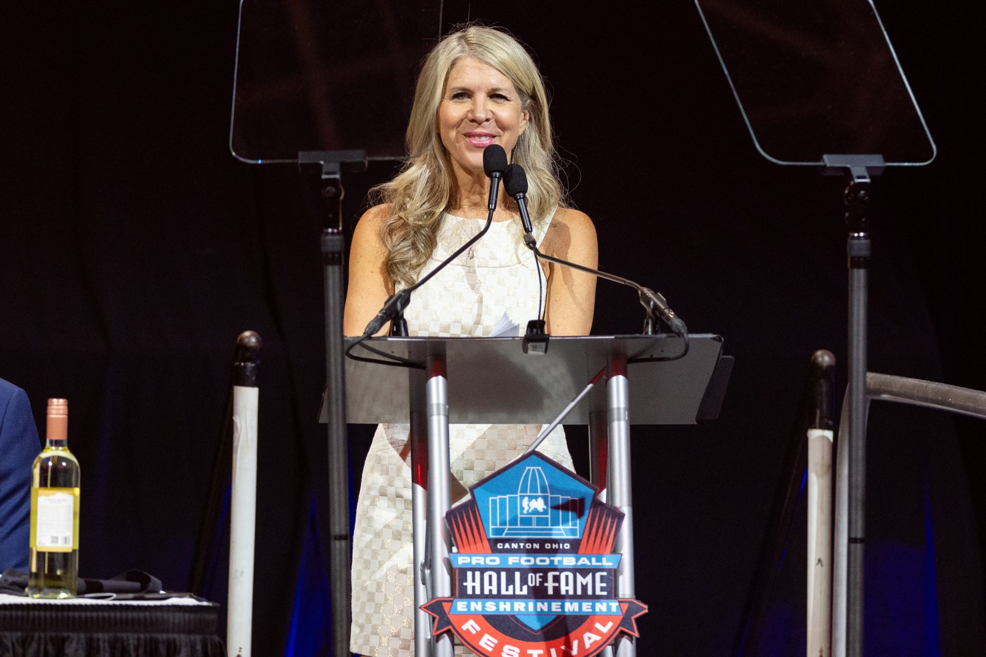 Mary Kay Cabot, the 57th Bill Nunn Memorial award honoree, speaks to the audience at the 2025 Pro Football Hall of Fame Enshrinees’ Gold Jacket Dinner at Canton Memorial Civic Center.