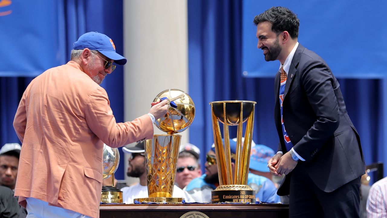 New York Knicks owner James Dolan reacts after receiving a key to the city from mayor Zohran Mamdani during a ceremony at New York City Hall after the championship parade - Source: Imagn Images