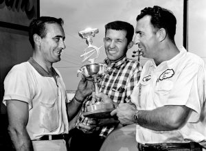 Drivers Billy Wade, left, Richard Petty and Ned Jarrett check over the first place trophy for the NASCAR 200-lap late model race at the Fairgrounds Speedway on June 13, 1964. Petty, in a 1964 Plymouth, went on to win the feature race the next day.
