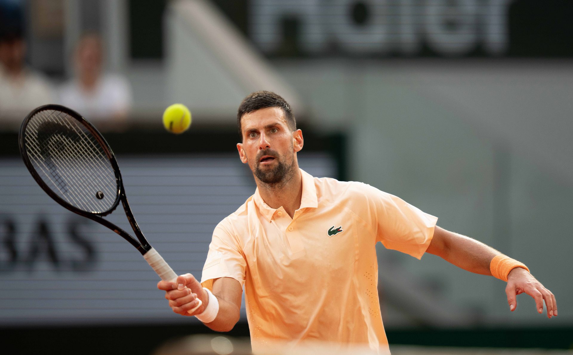 Novak Djokovic of Serbia returns a shot during his match against Joao Fonseca of Brazil on day six at Stade Roland Garros.