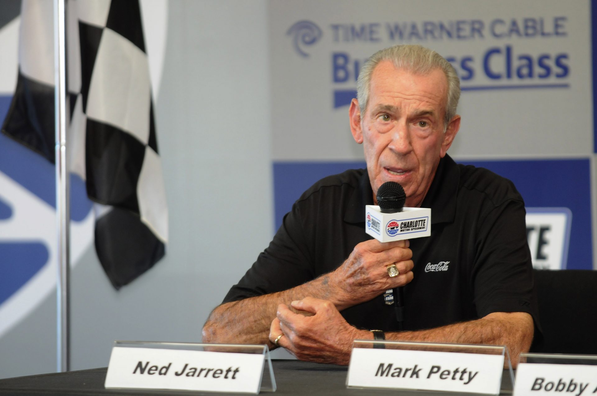 Former NASCAR Sprint Cup Series driver Ned Jarrett speaks about being inducted into the NASCAR Hall of Fame prior to the Bank of America 500 at Charlotte Motor Speedway.