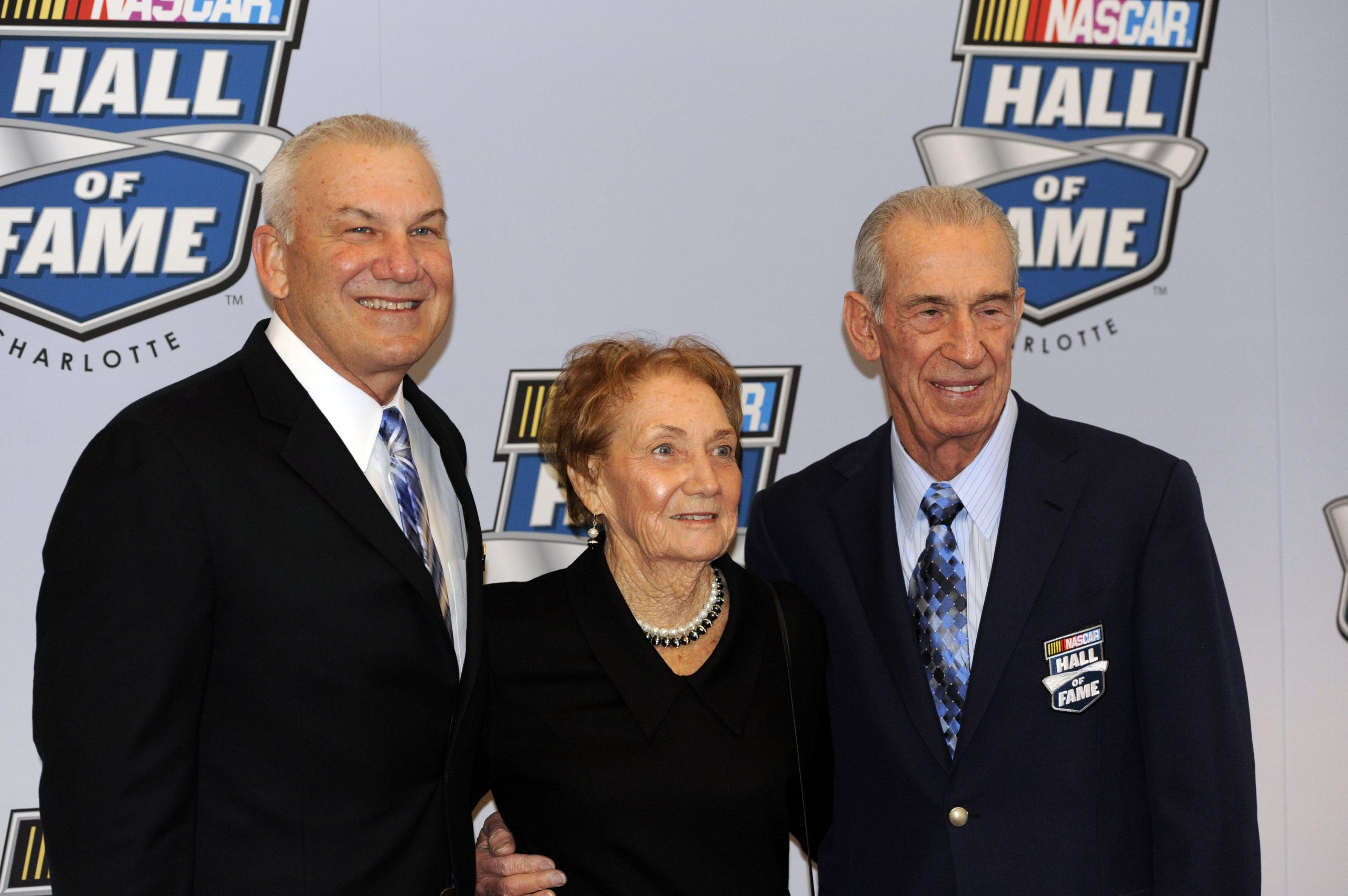 NASCAR hall of fame inductee driver Dale Jarrett (left) poses on the red carpet for pictures with his mother and father Martha and Ned Jarrett 