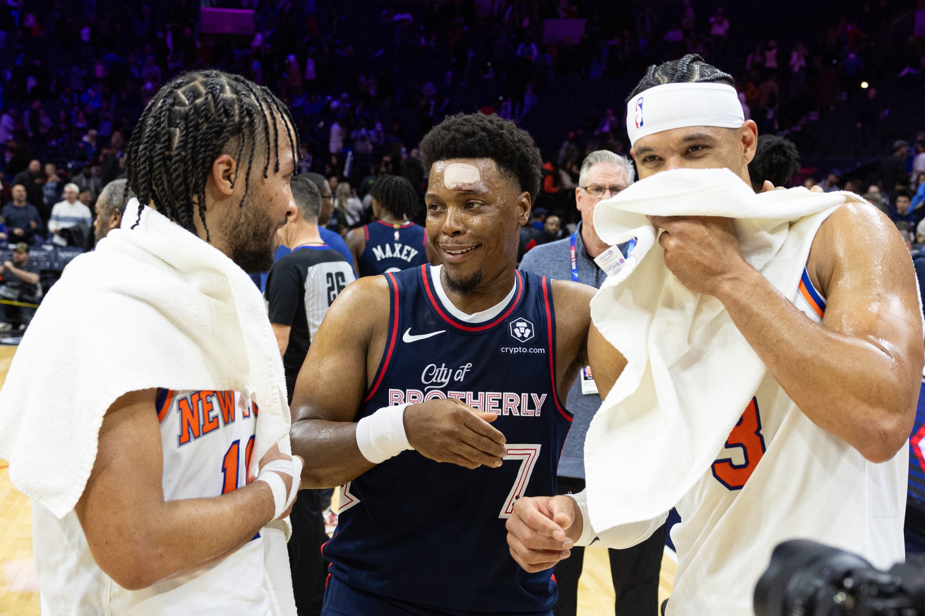 Villanova Wildcats alumni New York Knicks guard Jalen Brunson (11) and guard Josh Hart (3) and Philadelphia 76ers guard Kyle Lowry (7) meet on the court after a game at Wells Fargo Center. Source: Imagn