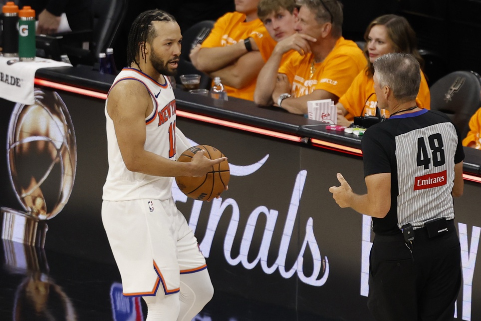 New York Knicks guard Jalen Brunson (11) argues with referee Scott Foster (48) at the conclusion of game one of the 2026 NBA Finals against the San Antonio Spurs at Frost Bank Center - Source: Imagn Images