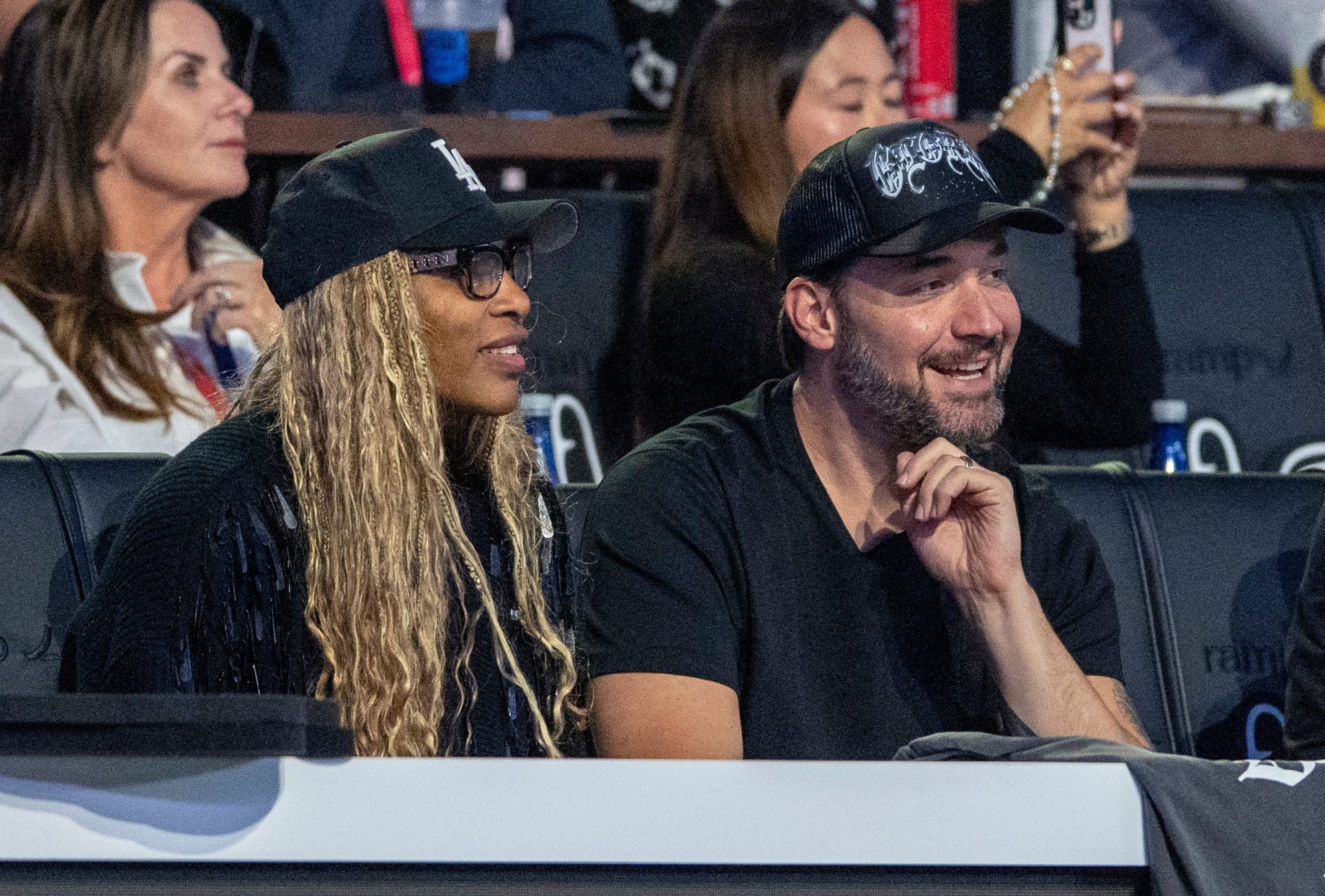 Serena Williams and Alexis Ohanian of Los Angeles Golf Club watch their team against Jupiter Links GC during theTGL finals at SoFi Center on March 23, 2026, in Palm Beach Gardens, Florida
