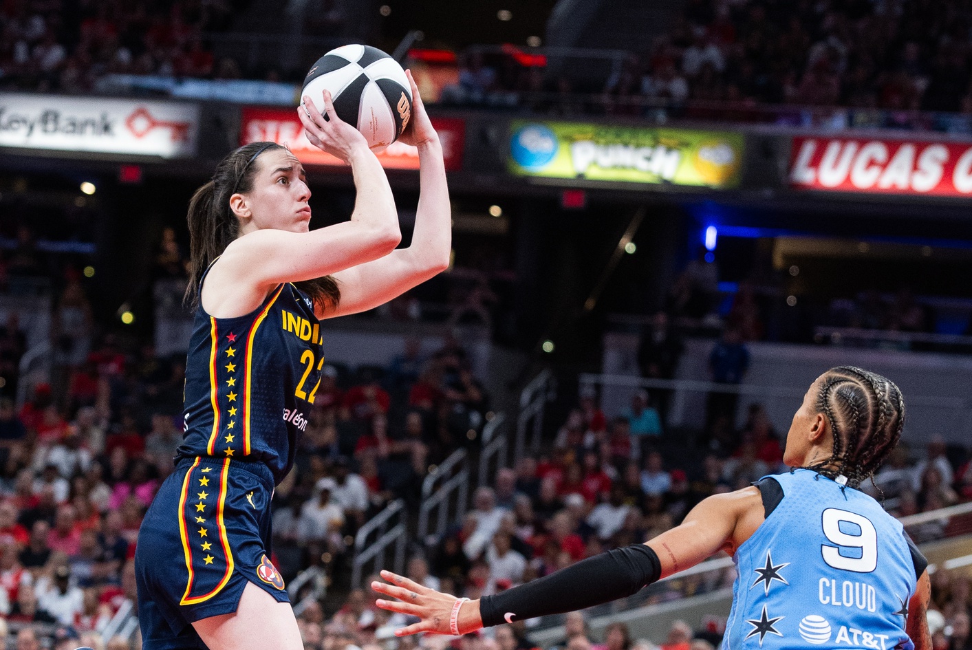 Indiana Fever guard Caitlin Clark (22) shoots the ball while Chicago Sky guard Natasha Cloud (9) defends in the second half at Gainbridge Fieldhouse - Source: Imagn Images