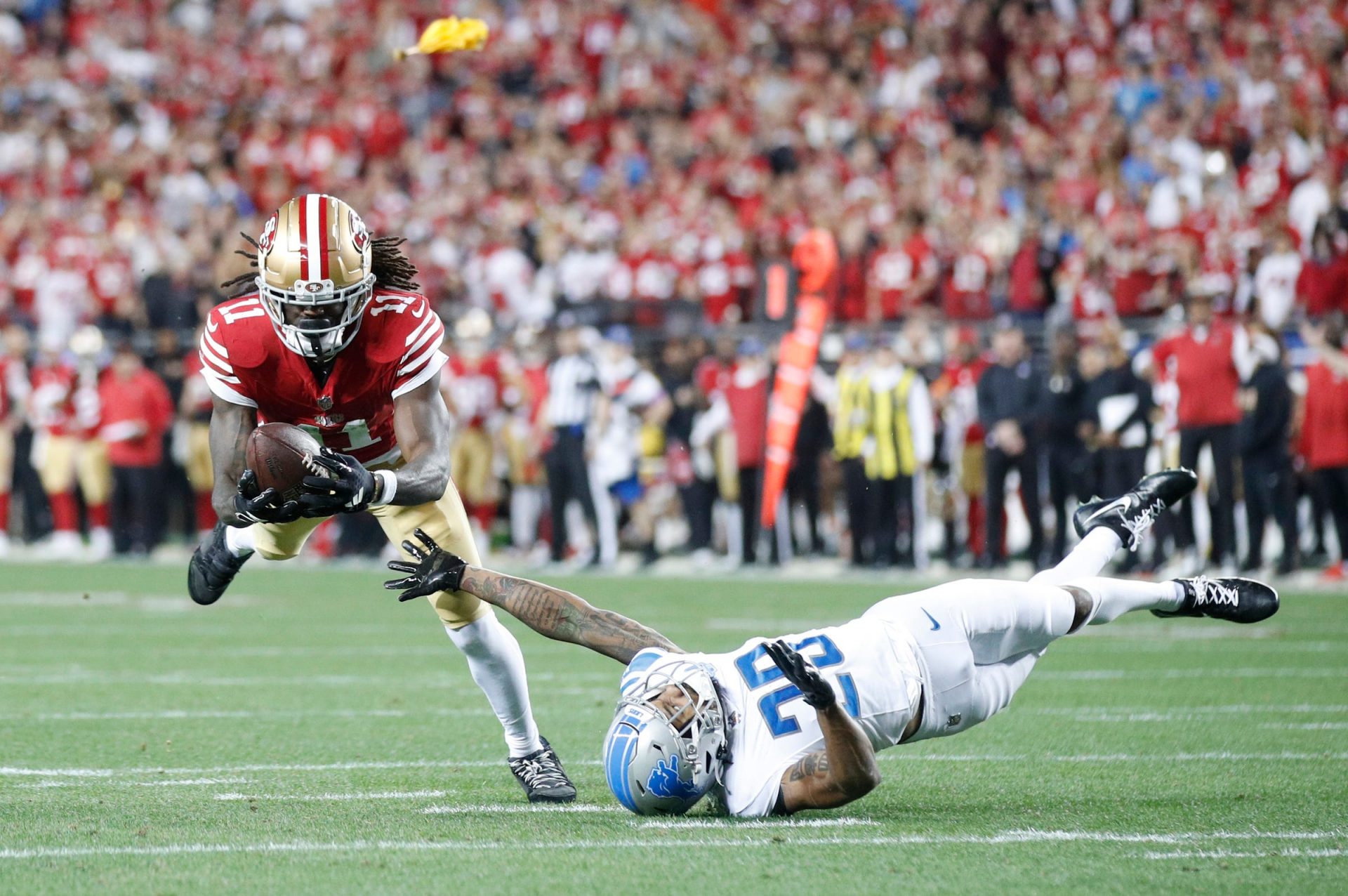 San Francisco 49ers wide receiver Brandon Aiyuk (11) catches the ball over Detroit Lions cornerback Kindle Vildor (29) in the third quarter of the NFC Championship game at Levi's Stadium in Santa Clara, Calif. on Sunday, January 28, 2024. Credit: Imagn