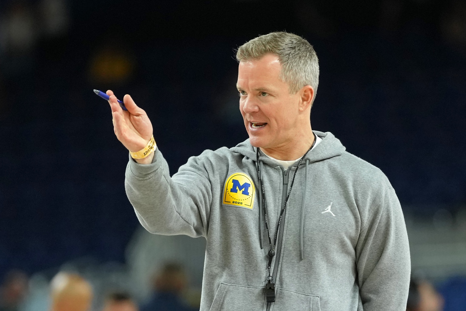 Michigan Wolverines head coach Dusty May looks on during a practice session ahead of the Final Four of the men's 2026 NCAA Tournament at Lucas Oil Stadium.