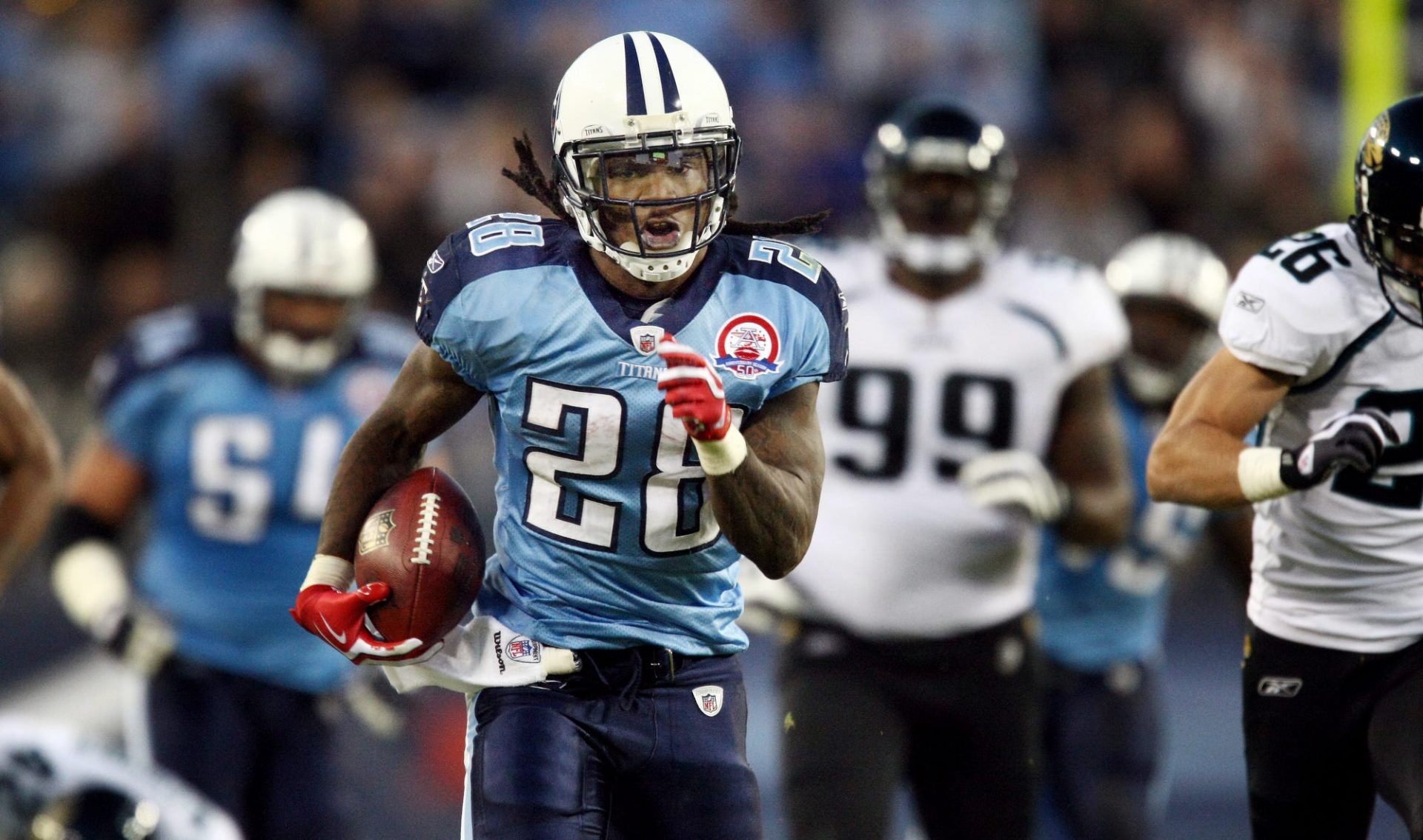 Tennessee Titans running back Chris Johnson (28) pulls away from Jacksonville Jaguars defense for a 52 yard touchdown run in the third quarter at LP Field on Nov. 1, 2009. The Titans defeated the Jaguars 30-13 for their first win of the season.