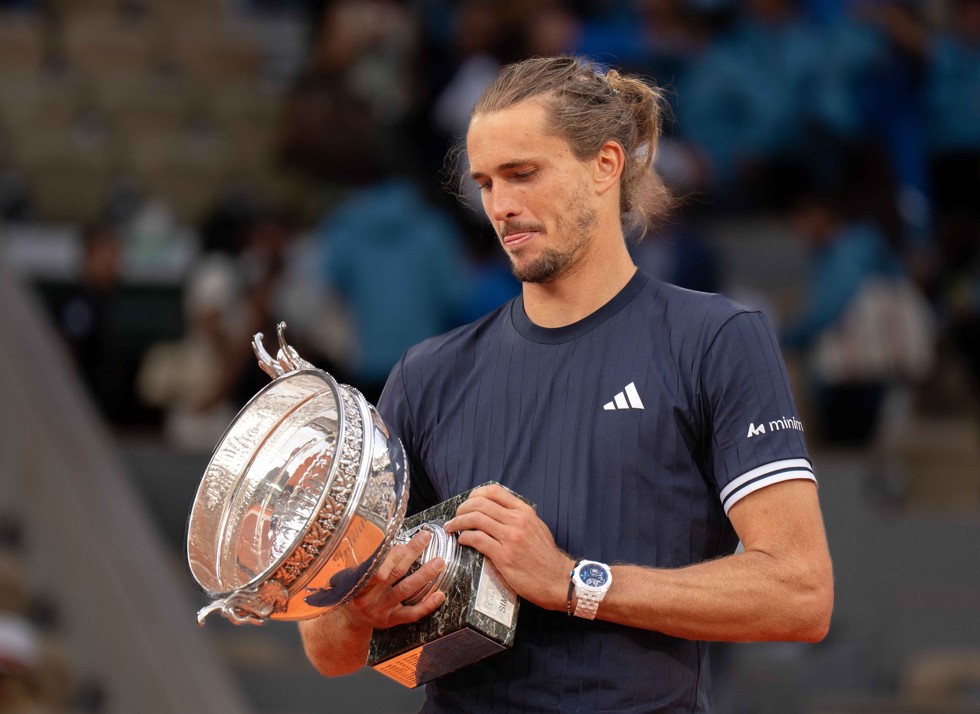 Alexander Zverev of Germany poses with the trophy after winning the mens singles final against Flavio Cobolli of Italy on day 15  at Stade Roland Garros.