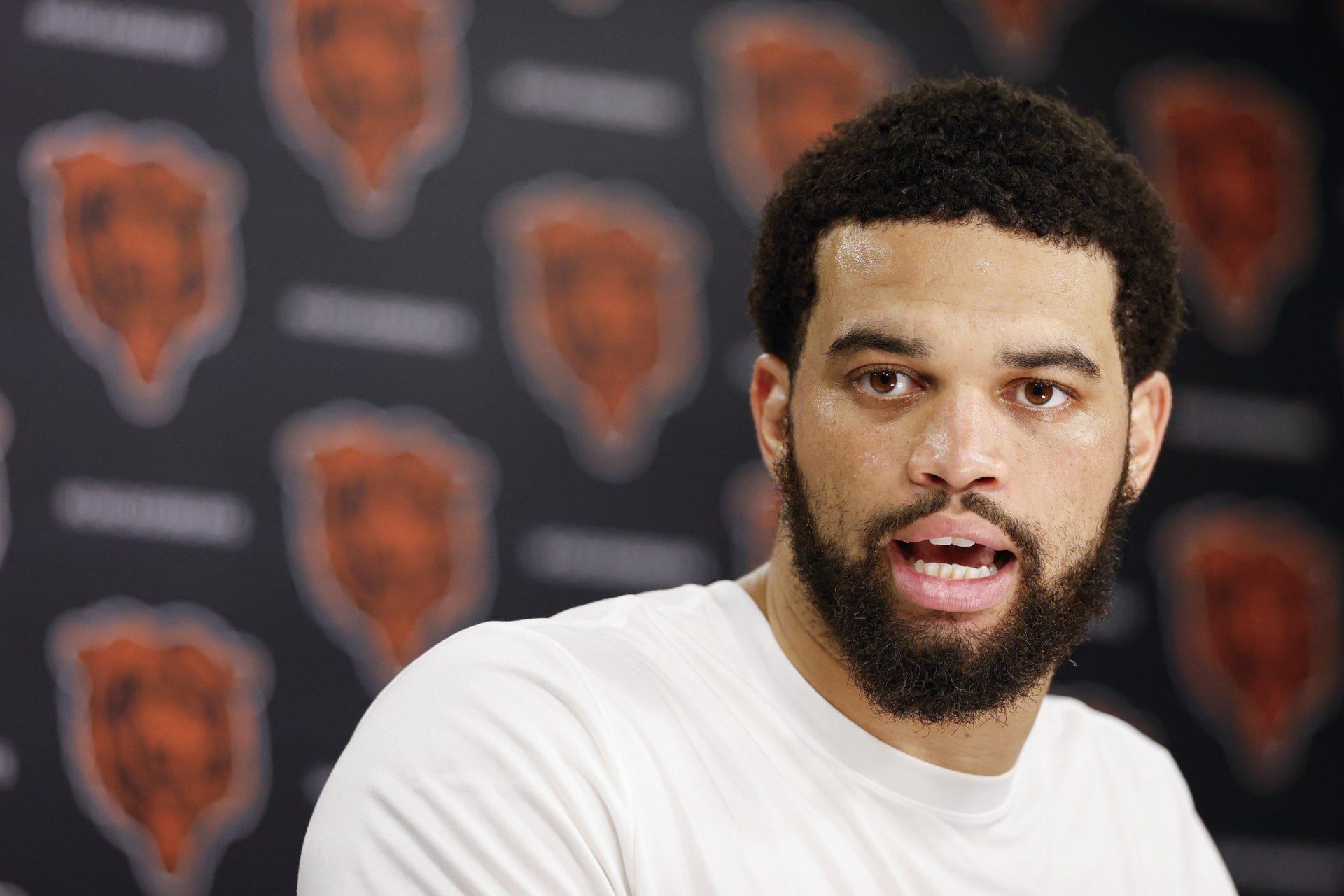 Chicago Bears quarterback Caleb Williams (18) speaks during Minicamp at Halas Hall.