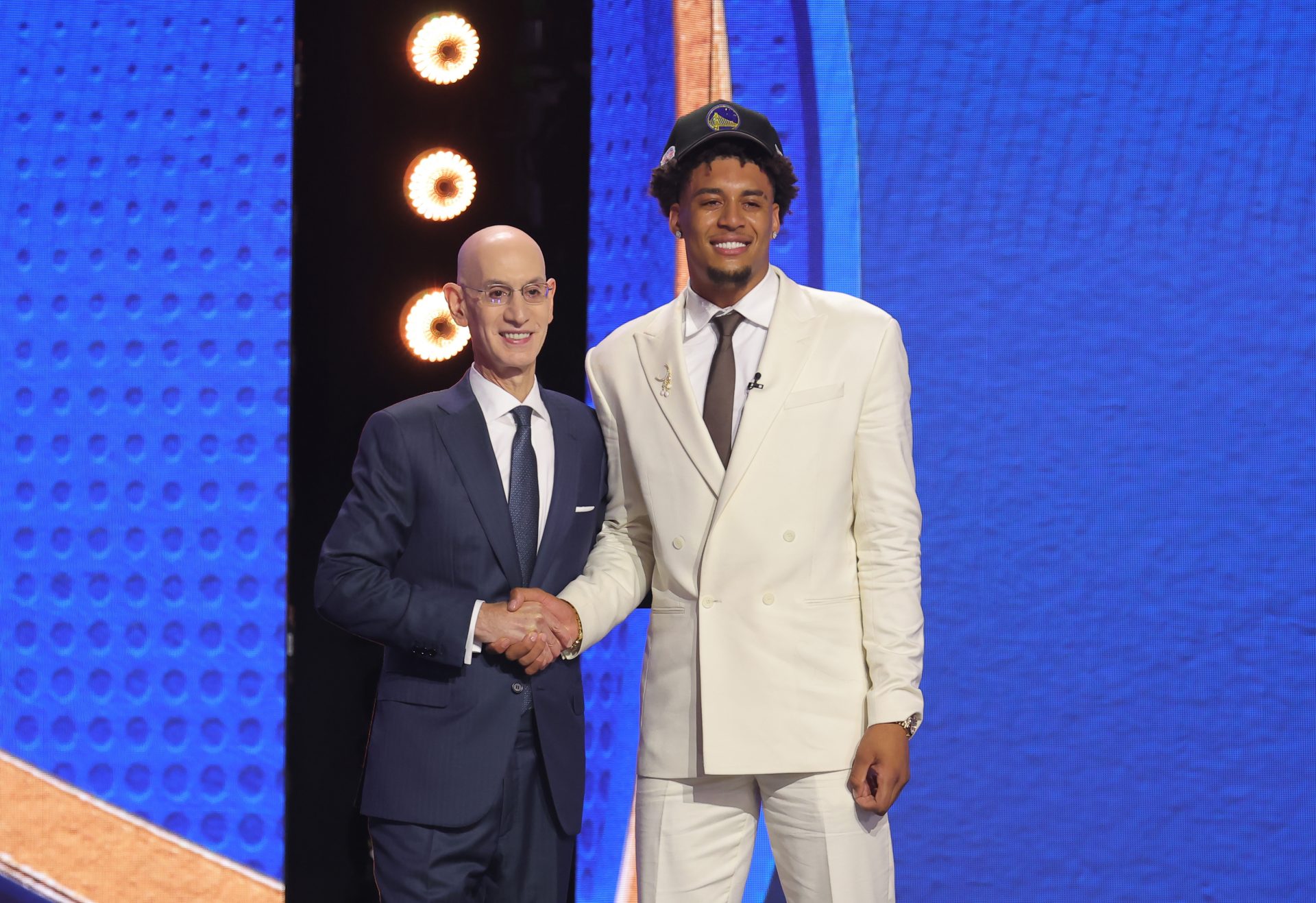 NBA commissioner Adam Silver greets the eleventh pick in the 2026 NBA draft, Michigan forward Yaxel Lendeborg after he was selected by the Golden State Warriors at Barclays Center.