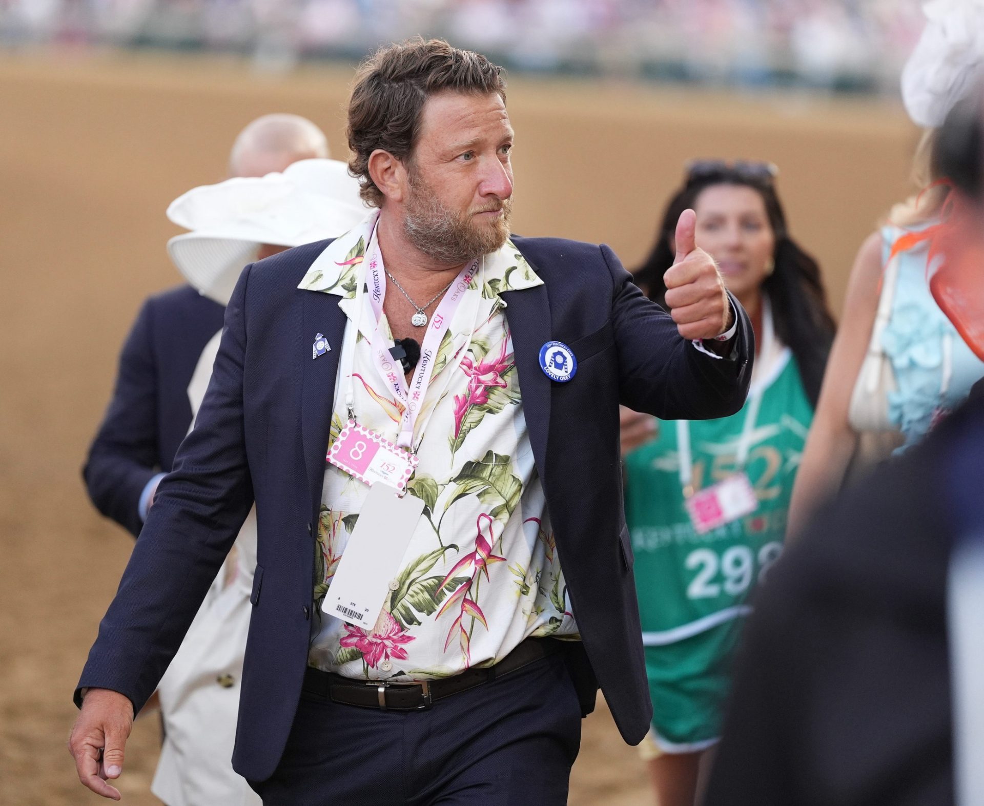 Dave Portnoy walks and gives a thumbs up to his fans during the 152nd running of the Kentucky Oaks at Churchill Downs.