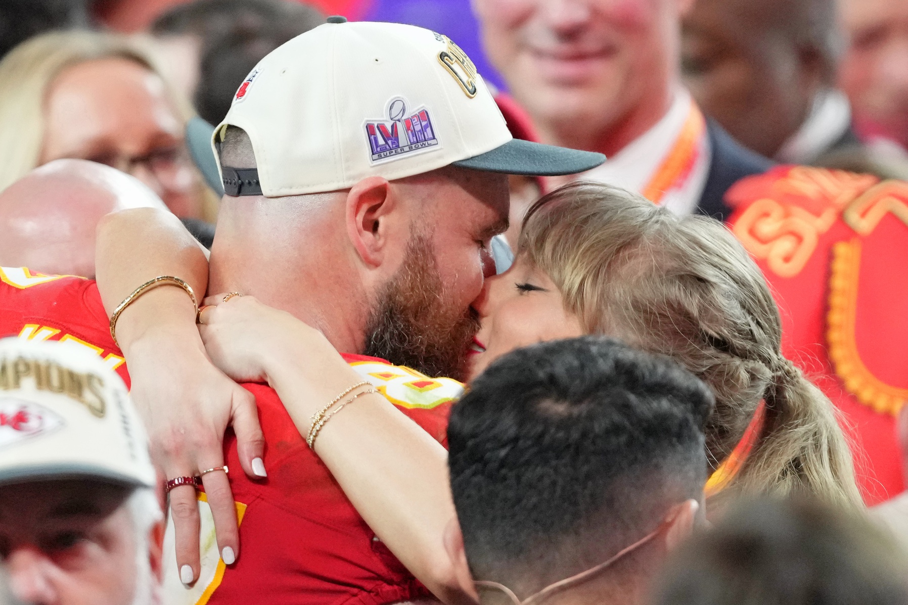 Kansas City Chiefs tight end Travis Kelce (87) kisses Recording artist Taylor Swift after winning Super Bowl LVIII against the San Francisco 49ers at Allegiant Stadium.