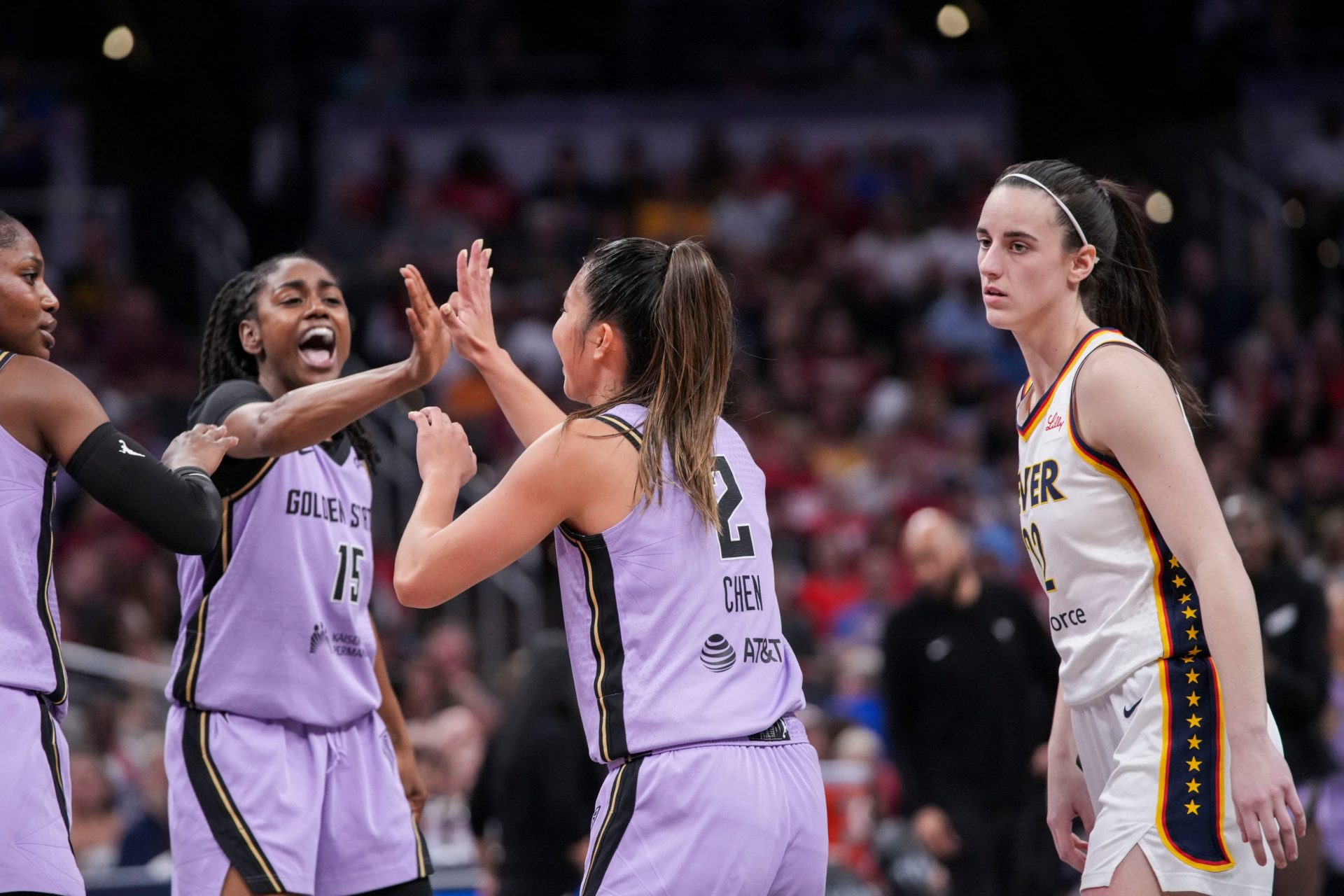 Indiana Fever guard Caitlin Clark (22) walks past Golden State Valkyries guard Tiffany Hayes (15) and Golden State Valkyries guard Kaitlyn Chen (2) on Wednesday, July 15, 2026, during the second half of a game at Gainbridge Fieldhouse in Indianapolis. The Golden State Valkyries defeated the Indiana Fever, 88-75. Credit: Imagn