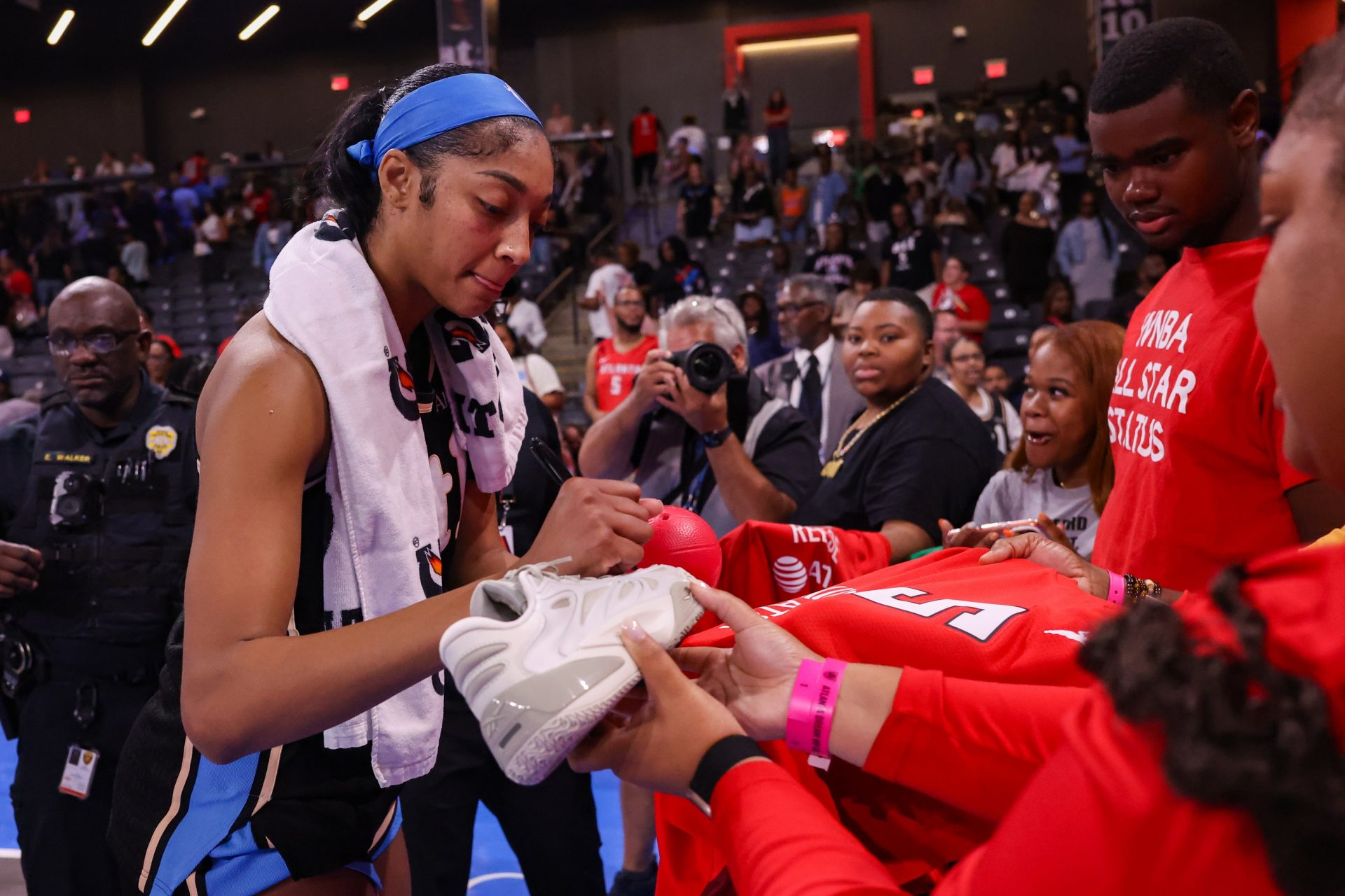 Atlanta Dream forward Angel Reese (5) signs autographs after a game against the Seattle Storm  - Source: Imagn Images