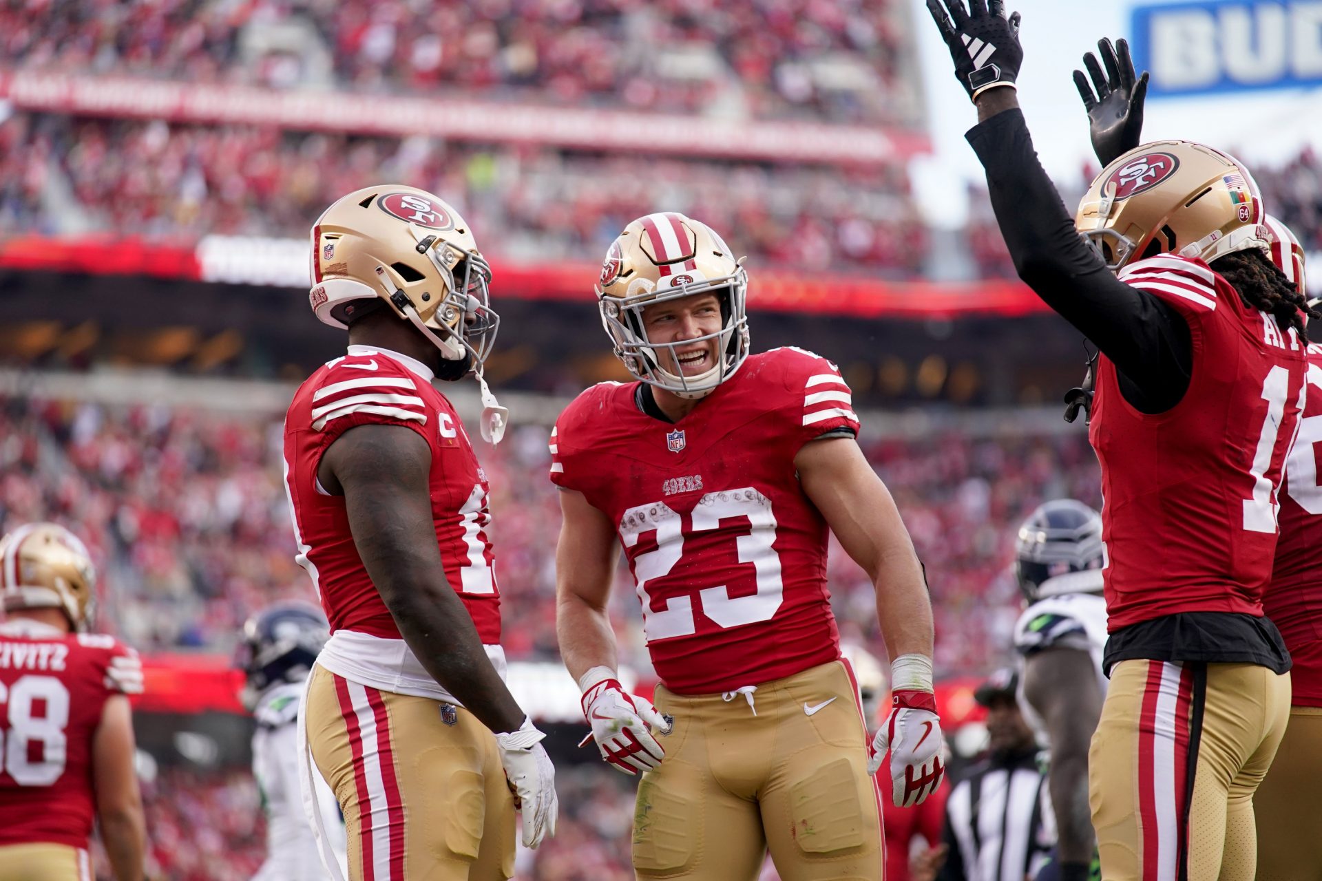 San Francisco 49ers running back Christian McCaffrey (23) stands next to wide receiver Deebo Samuel (19) and wide receiver Brandon Aiyuk (11) after the 49ers picked up a first down near the end zone against the Seattle Seahawks in the third quarter at Levi's Stadium.