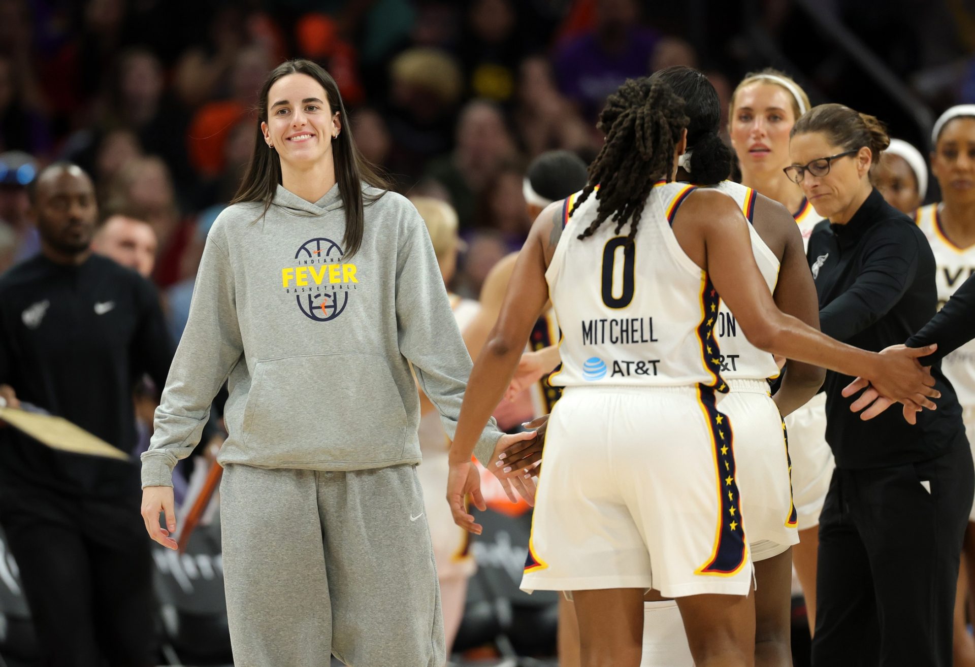 Indiana Fever guard Caitlin Clark celebrates with Kelsey Mitchell (0) against the Phoenix Mercury in the second half - Source: Imagn Images