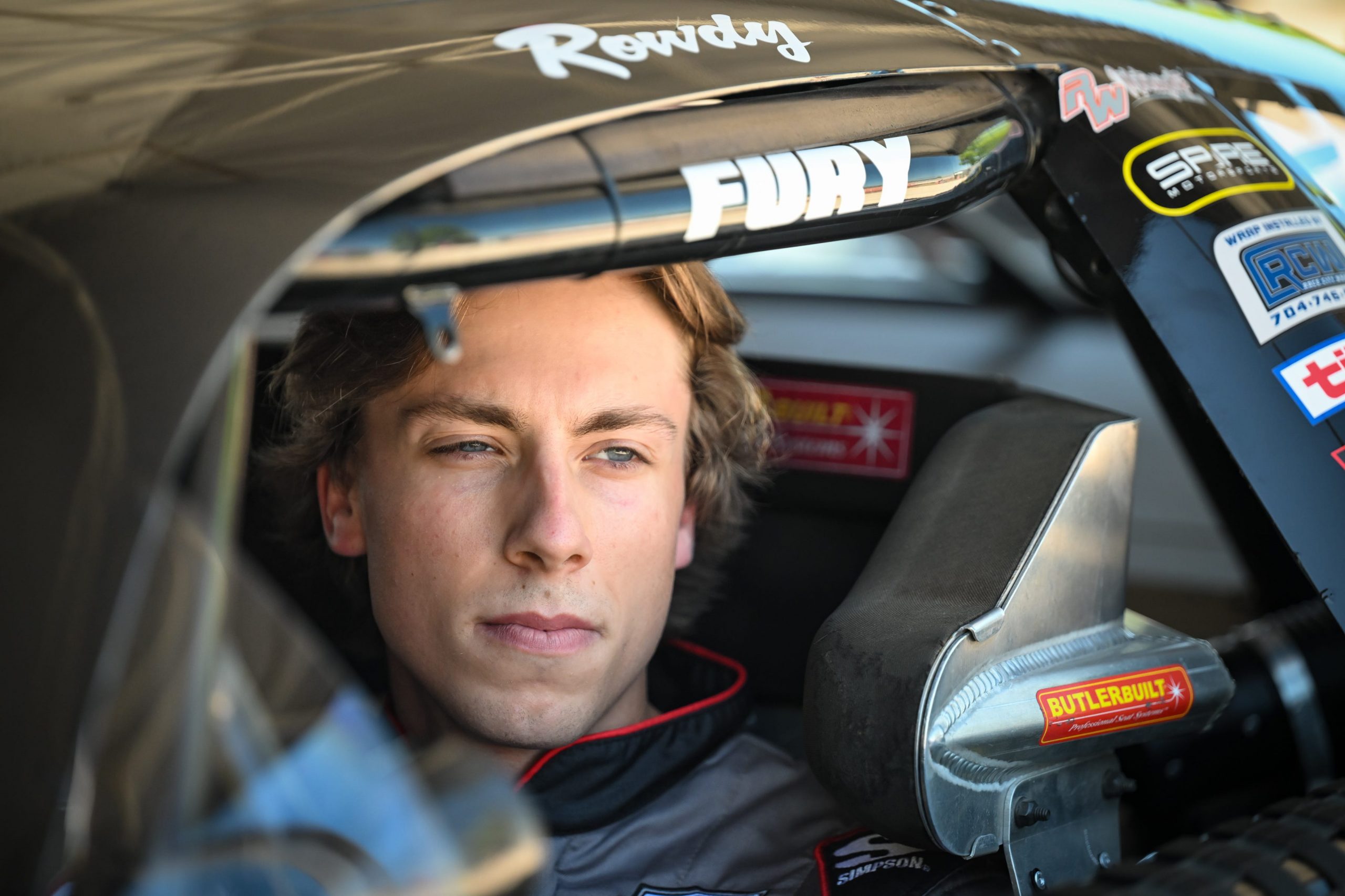 Carson Hocevar gets settled into his car for practice at the 47th Slinger Nationals on Tuesday, July 14, 2026, at Slinger Speedway in Slinger, Wisconsin.