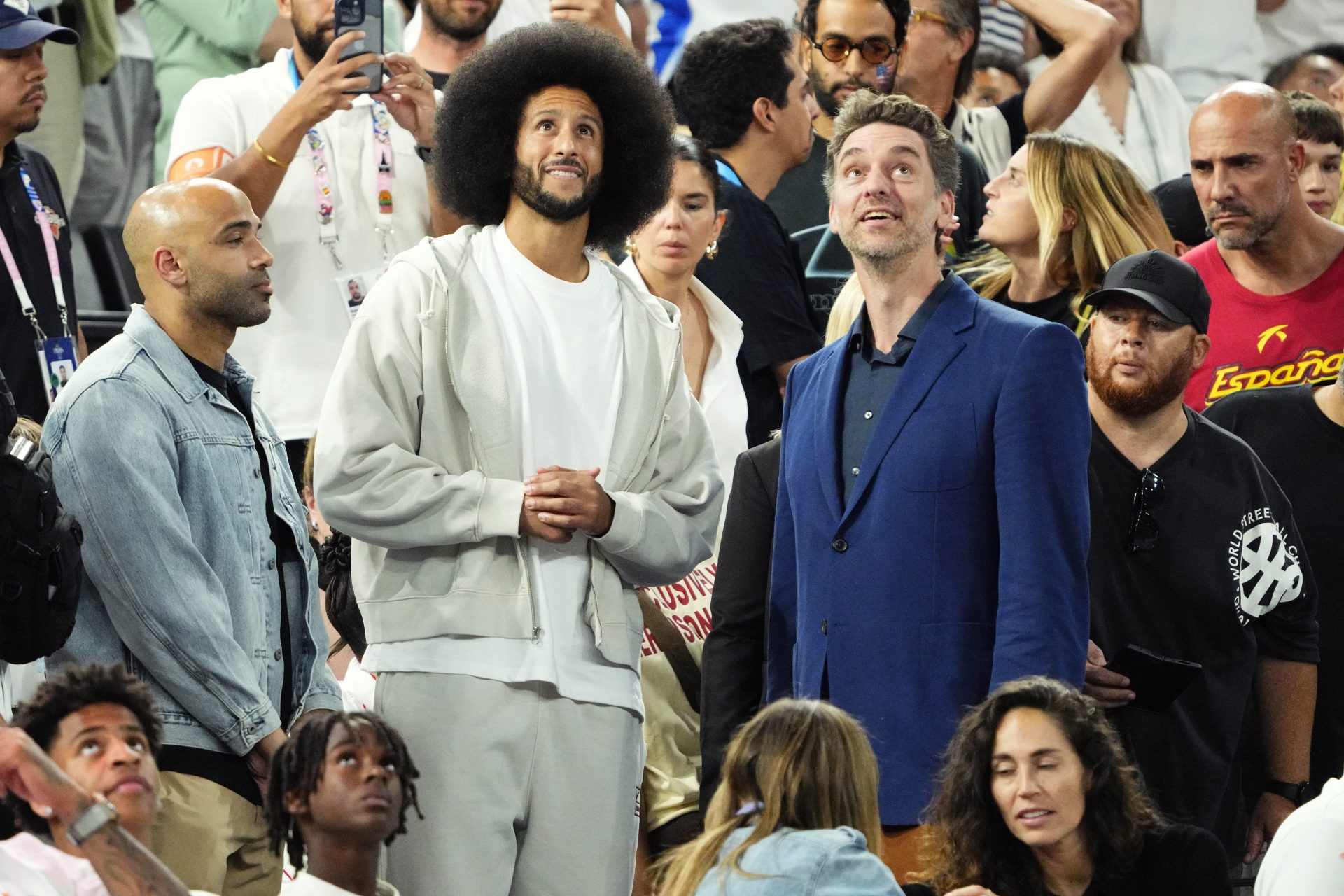 Former NFL player Colin Kaepernick and former NBA player Pau Gasol looks on during the first half between the United States and Serbia in a men's basketball semifinal game during the Paris 2024 Olympic Summer Games at Accor Arena.