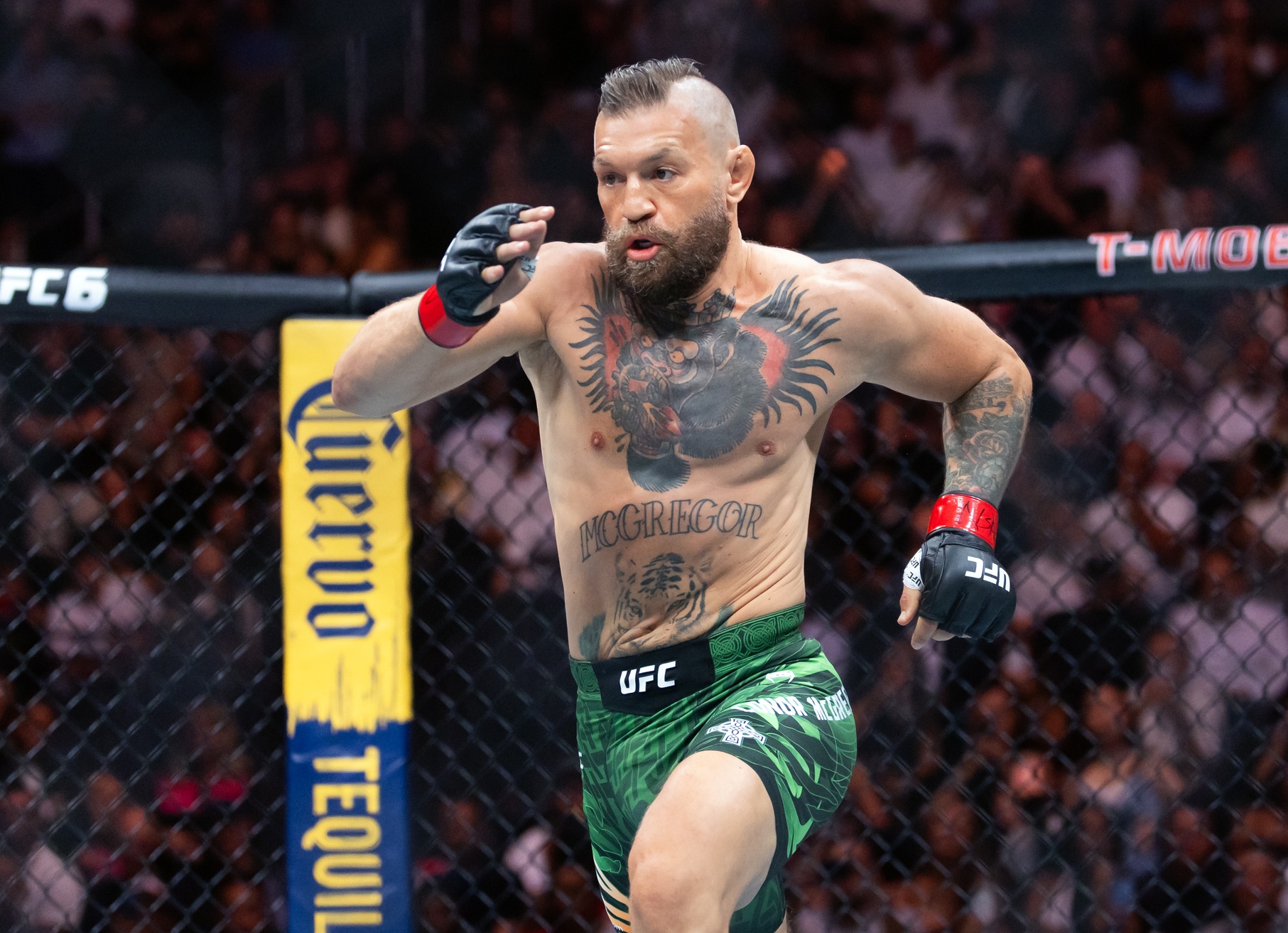 Conor McGregor runs to Max Holloway (not pictured) during UFC 329 at T-Mobile Arena.