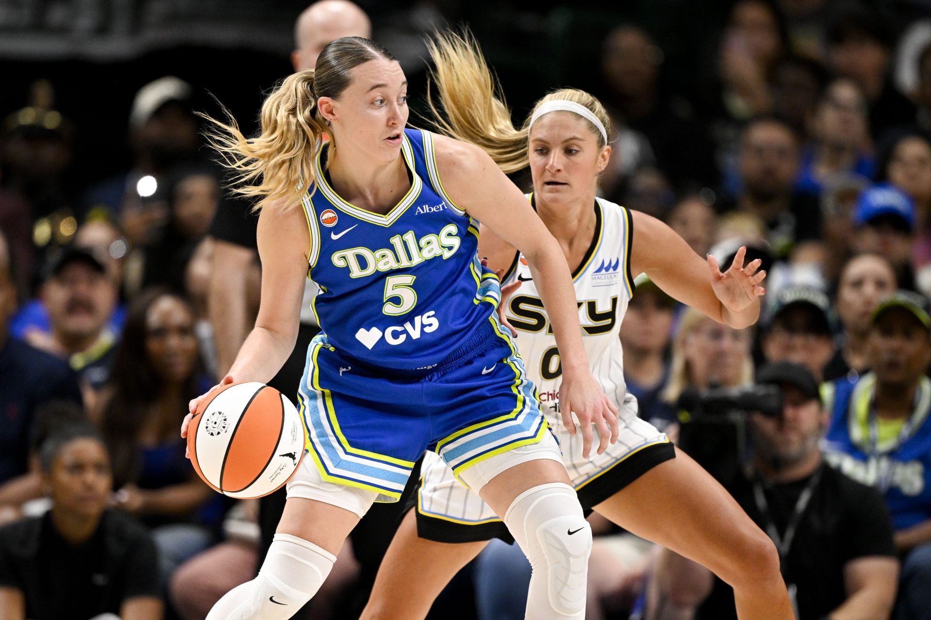 Dallas Wings guard Paige Bueckers (5) looks to move the ball past Chicago Sky guard Jacy Sheldon (0) during the second half  - Source: Imagn Images