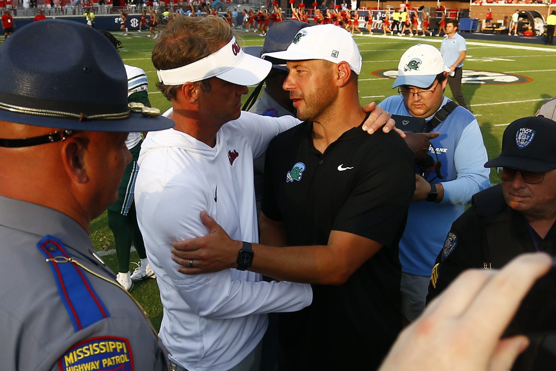 Mississippi Rebels head coach Lane Kiffin (left) and Tulane Green Wave head coach Jon Sumrall (right) embrace after the game at Vaught-Hemingway Stadium.