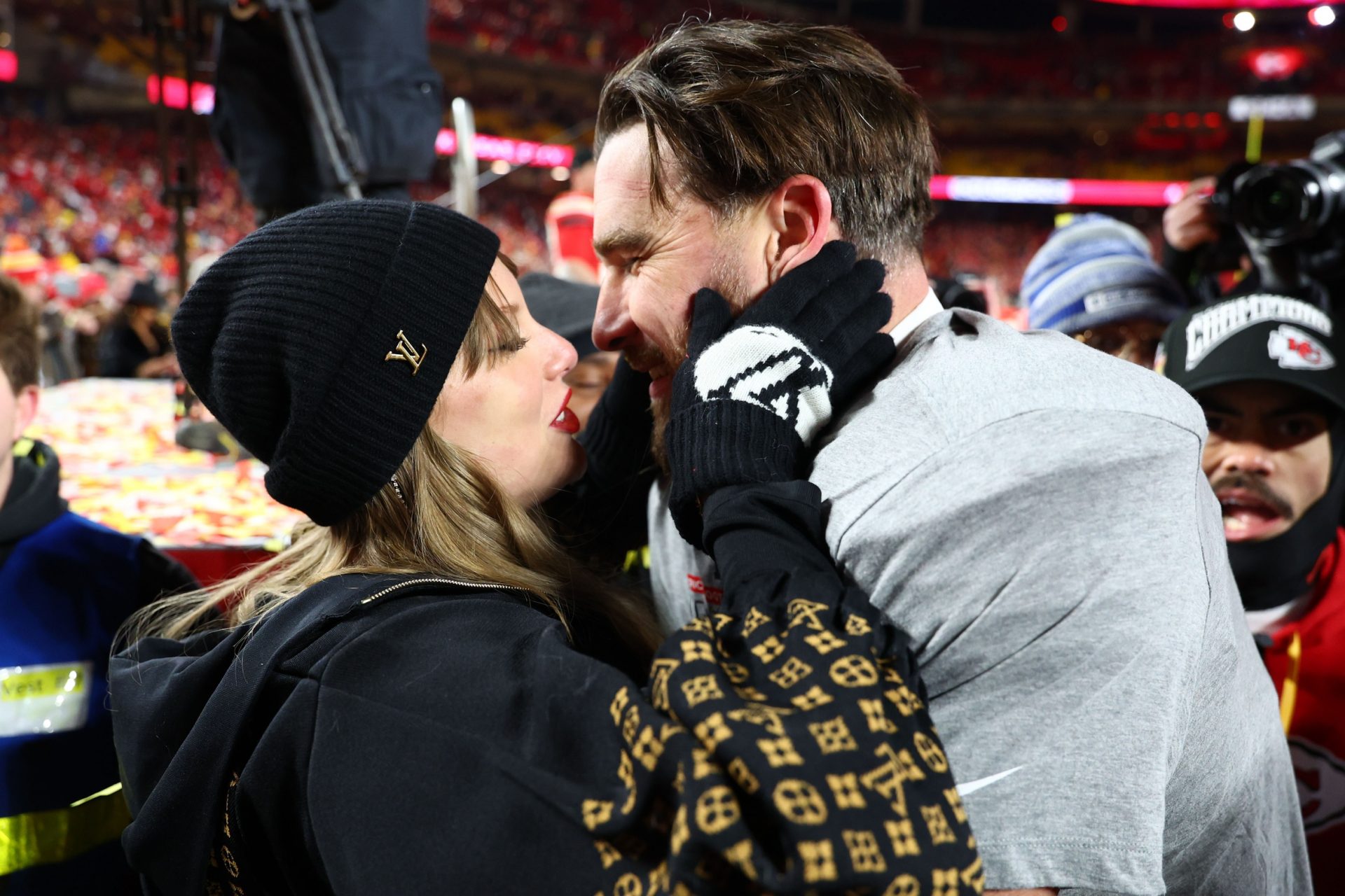 Recording artist Taylor Swift  and Kansas City Chiefs tight end Travis Kelce (87) react after the AFC Championship game against the Buffalo Bills at GEHA Field at Arrowhead Stadium. Source: Imagn