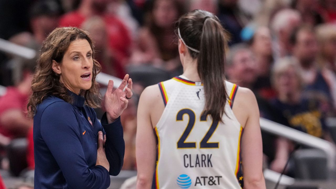 Indiana Fever head coach Stephanie White talks with Indiana Fever guard Caitlin Clark (22) on Wednesday, June 24, 2026, during the first half of a game at Gainbridge Fieldhouse in Indianapolis - Source: Imagn Images