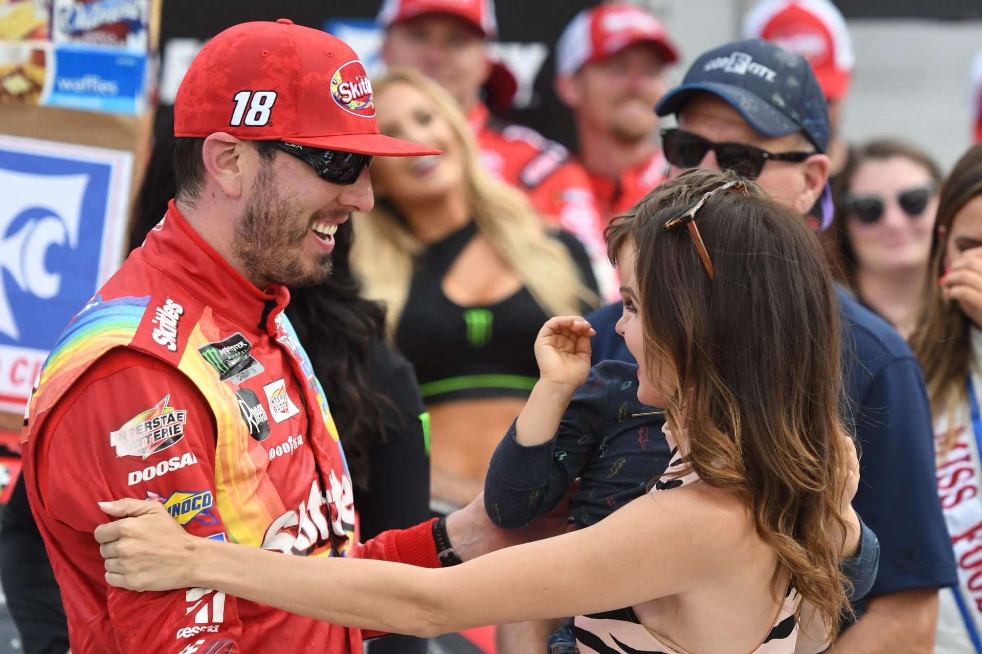 Monster Energy NASCAR Cup Series driver Kyle Busch (18) celebrates with his wife Samantha after winning the Food City 500 at Bristol Motor Speedway.