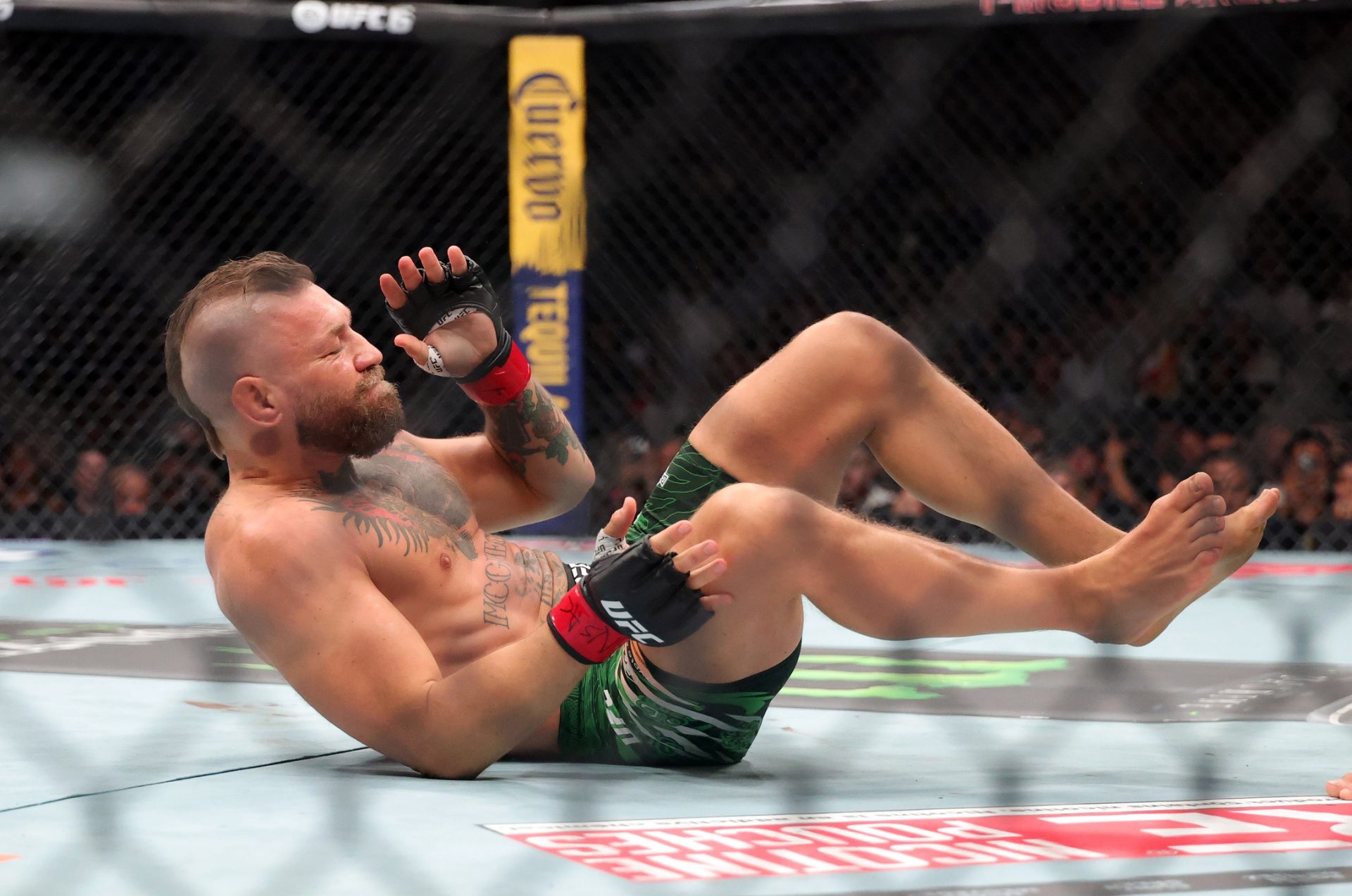 Conor McGregor on the ground during UFC 329 at T-Mobile Arena.