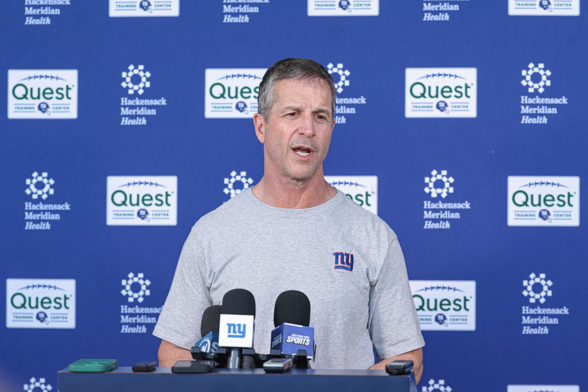 New York Giants head coach John Harbaugh talks with media after organized team activities at Quest Diagnostics Training Center.