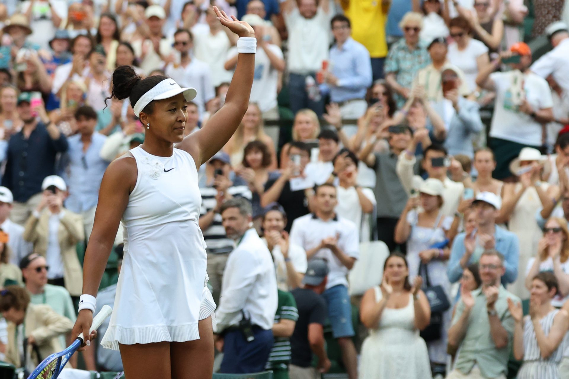 Naomi Osaka (JPN) waves to the crowd after her match against Aryna Sabalenka (not pictured) on day seven of The Championships Wimbledon 2026 at All England Lawn Tennis and Croquet Club.