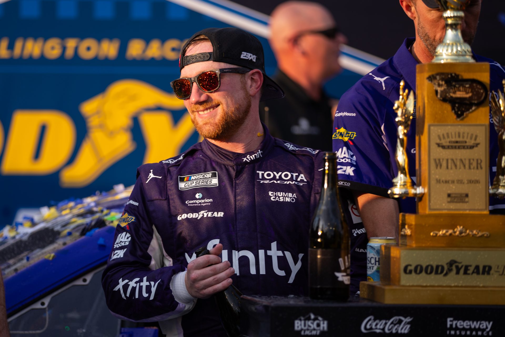 23XI Racing Tyler Reddick (45) celebrates in Victory Lane after winning at Darlington Raceway.
