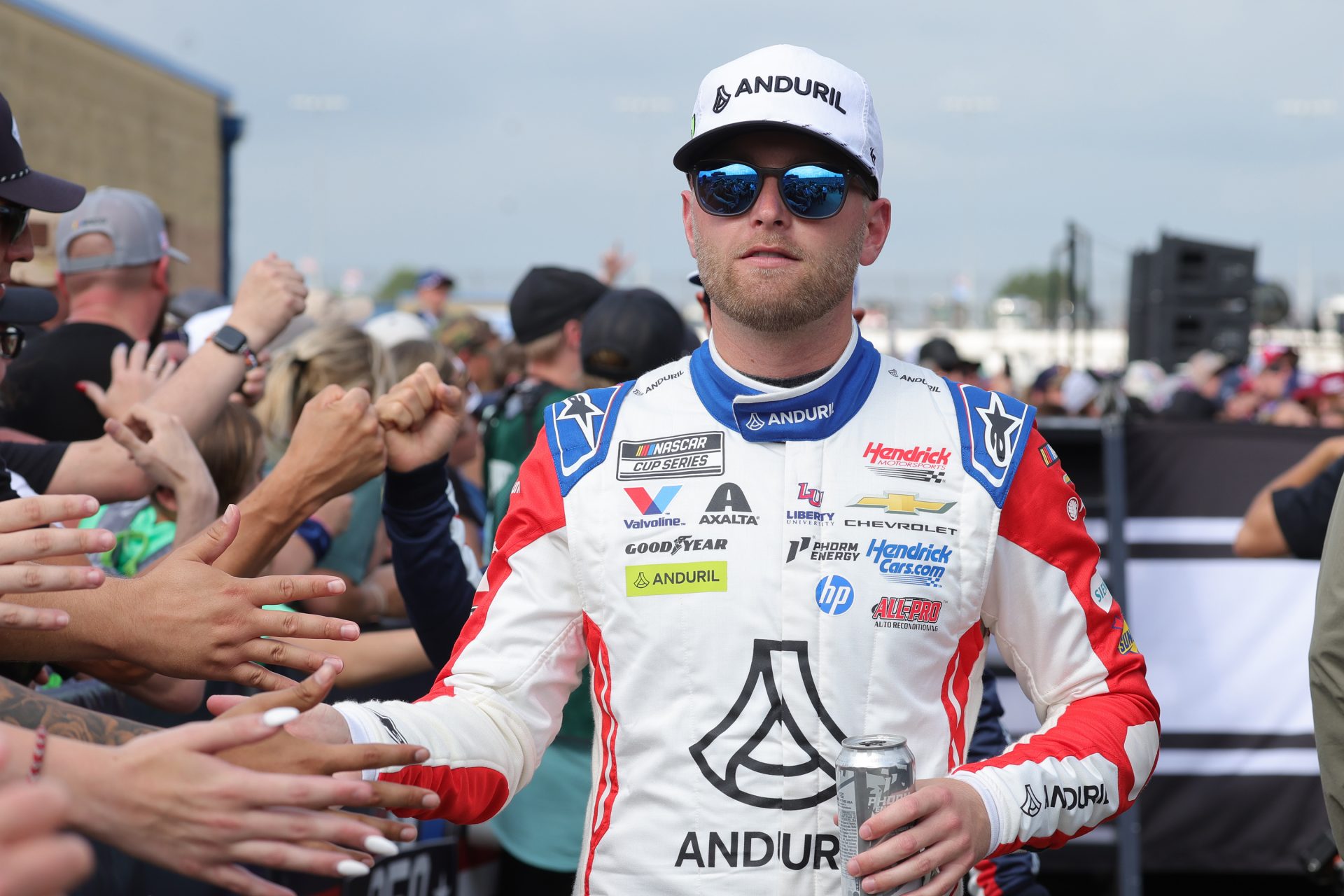 NASCAR Cup Series driver William Byron (24) shakes hands with fans before the eero 400 at Chicagoland Speedway.