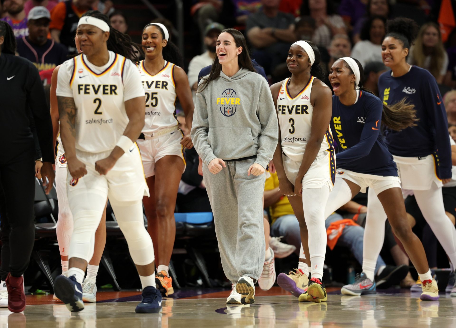 Indiana Fever guard Caitlin Clark (center) celebrates against the Phoenix Mercury in the second half at Mortgage Matchup Center.
