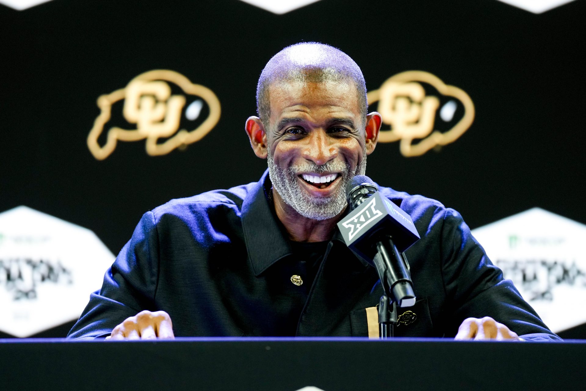 Colorado head coach Deion Sanders speaks to reporters during Big 12 Conference Football Media Days at The Star. 
Source: Imagn
