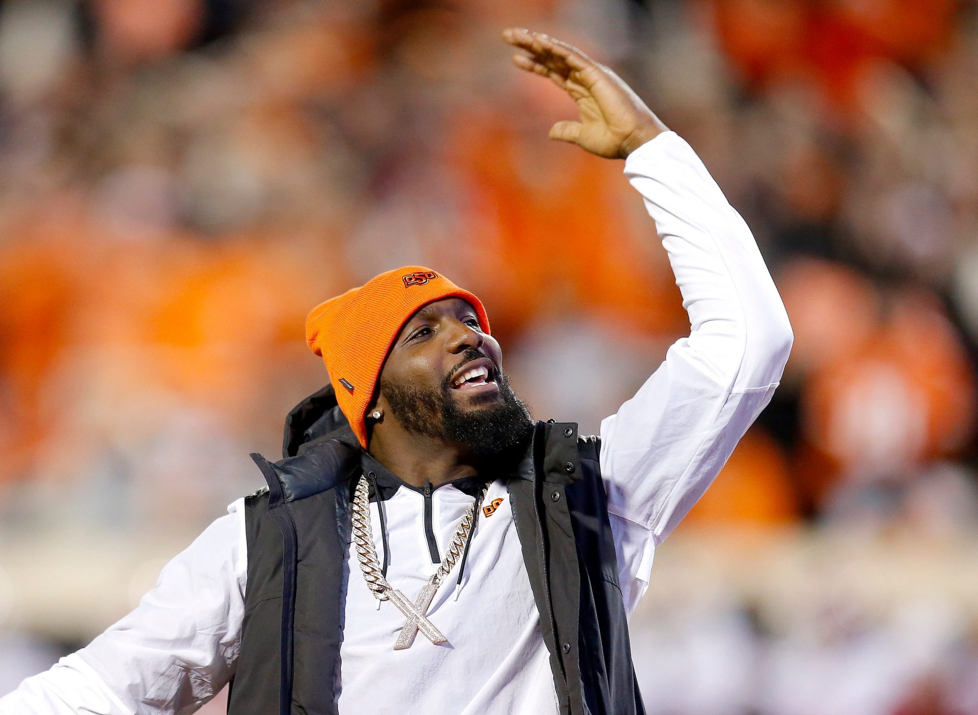 Dez Bryant pumps up the crowd during a Bedlam college football game between the Oklahoma State University Cowboys (OSU) and the University of Oklahoma Sooners (OU) at Boone Pickens Stadium in Stillwater, Okla., Saturday, Nov. 27, 2021. OSU won 37-33.