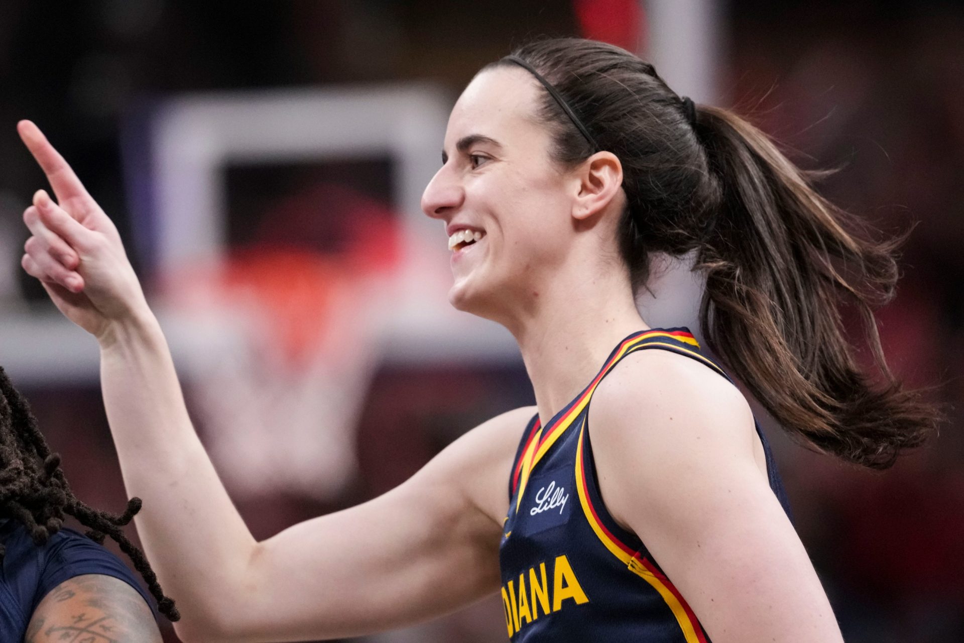 Indiana Fever guard Caitlin Clark (22) celebrates after scoring Saturday, July 18, 2026, during the second half of a game at Gainbridge Fieldhouse in Indianapolis - Source: Imagn Images