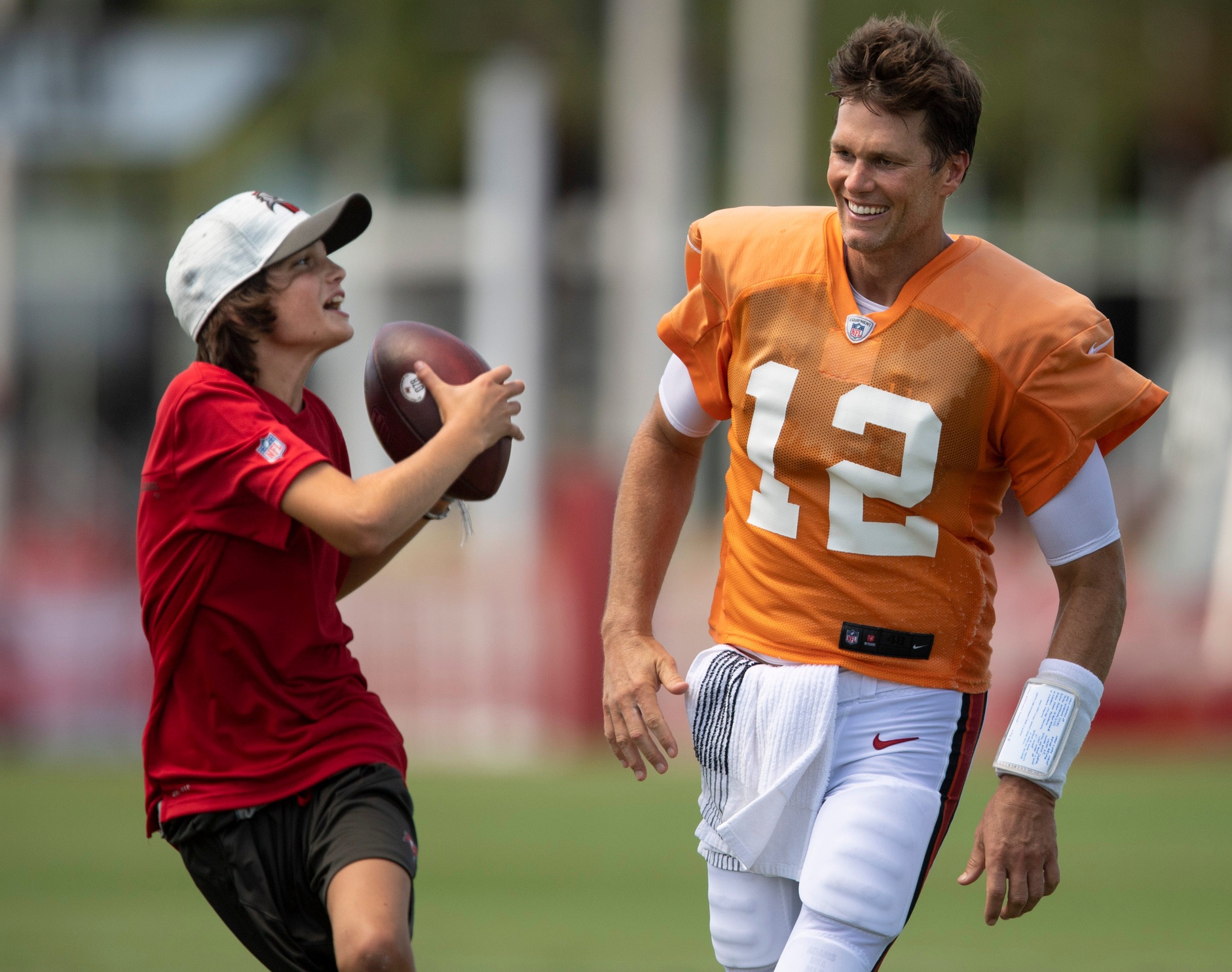 Five years ago, Tom Brady was the quarterback for the Tampa Bay Buccaneers, playing catch with his son Jack. Credit: Imagn