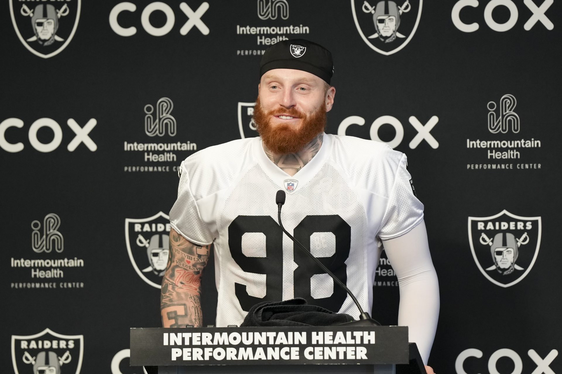 Las Vegas Raiders defensive end Maxx Crosby (98) speaks during a news conference during organized team activities at Intermountain Health Performance Center.