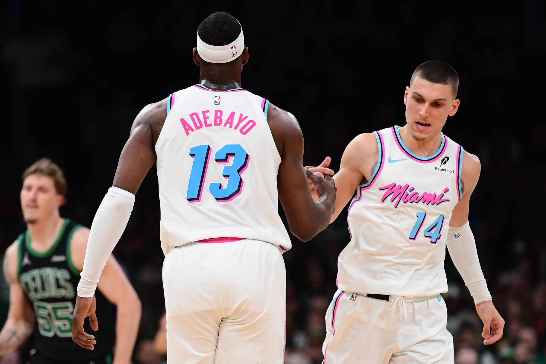 Miami Heat center Bam Adebayo (13) is congratulated by guard Tyler Herro (14) after making a basket during the second half against the Boston Celtics - Source: Imagn Images